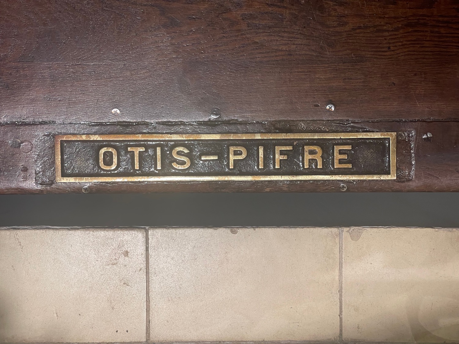 a sign on a wood surface