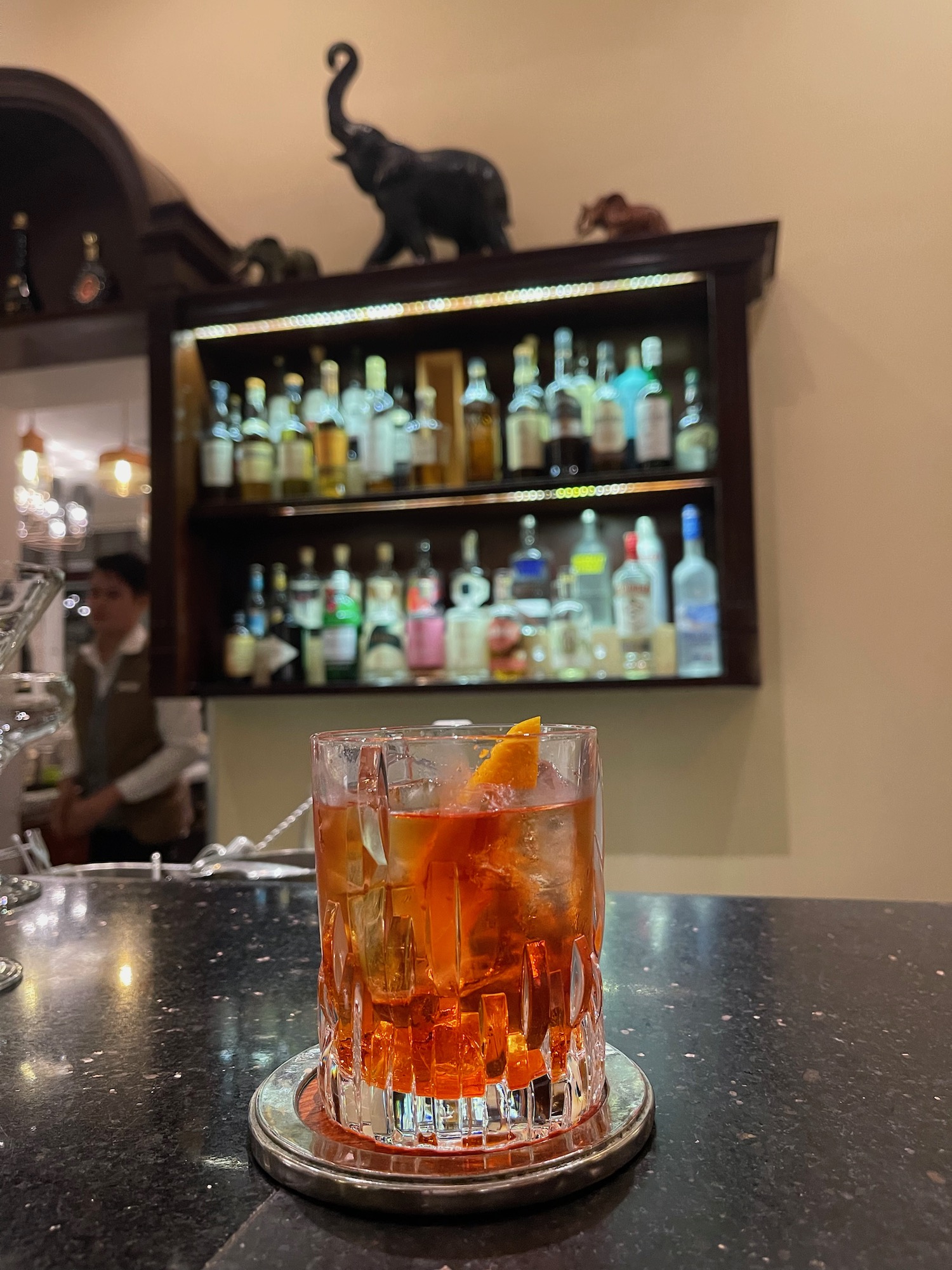 a glass of alcohol on a counter