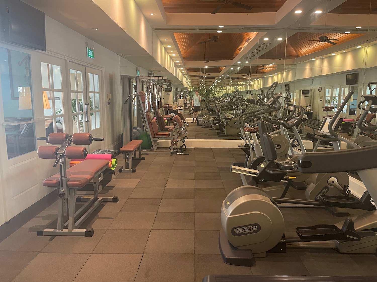 a large room with exercise equipment