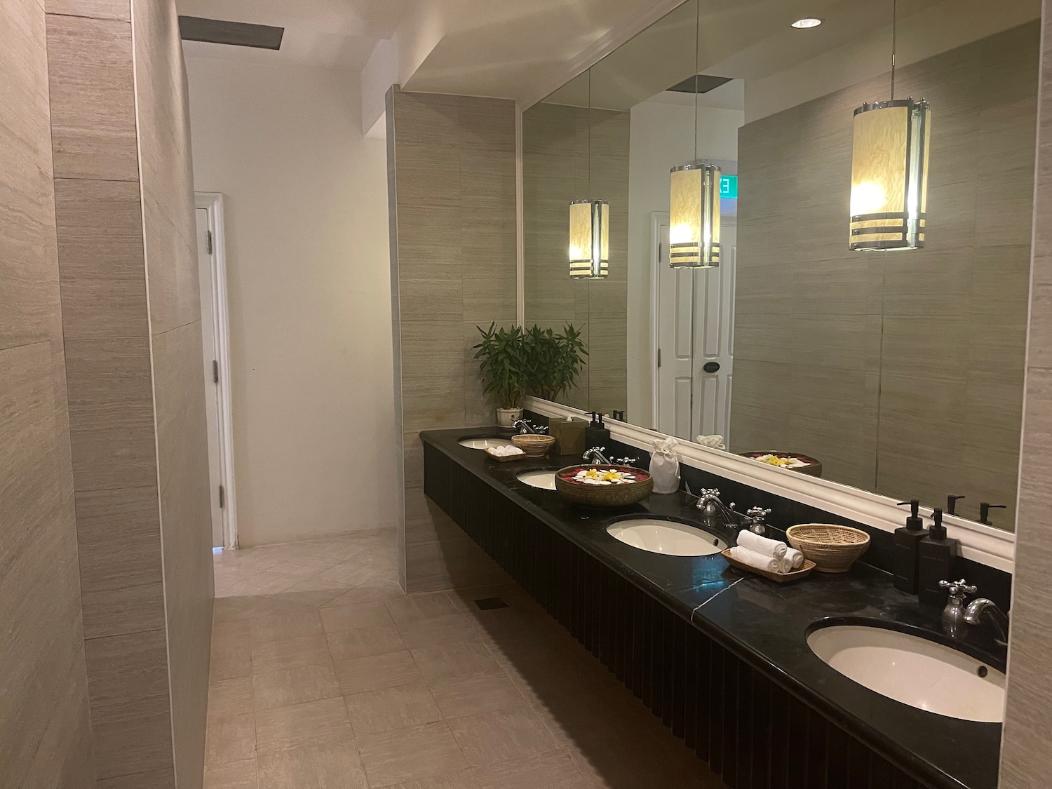 a bathroom with sinks and a large mirror