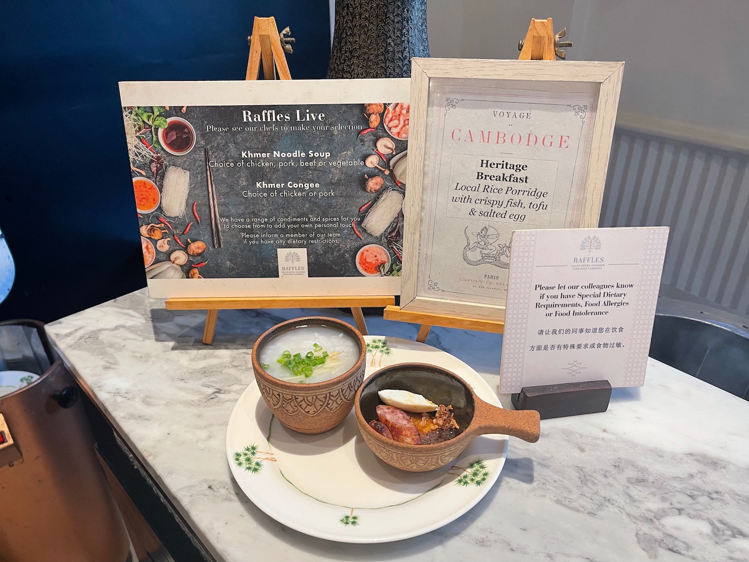 a plate of soup and a bowl of soup on a table with a menu