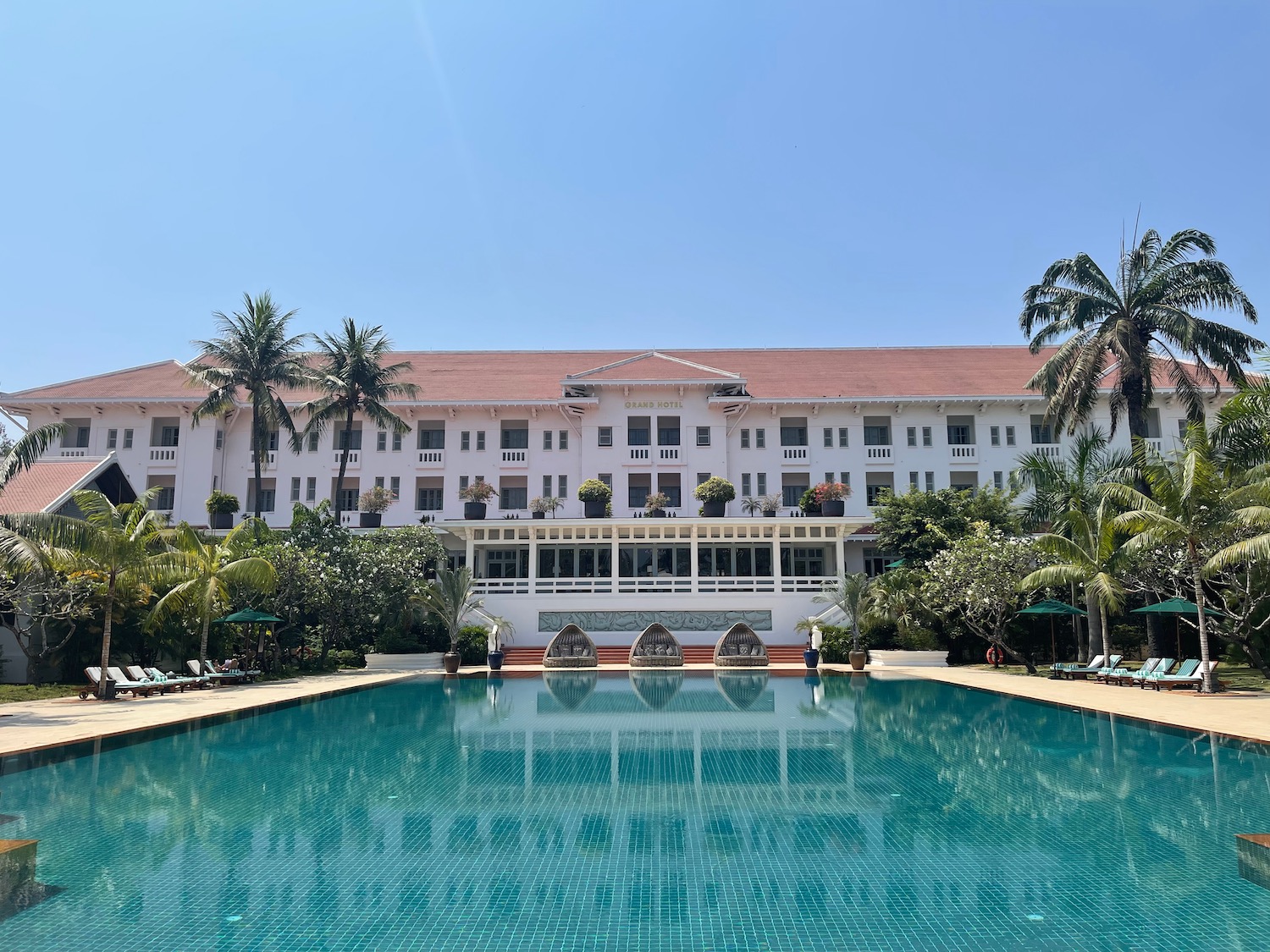 a pool with a building in the background