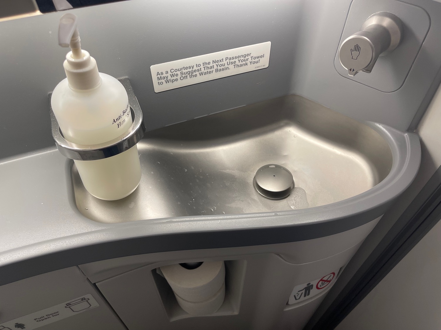 a soap dispenser on a sink