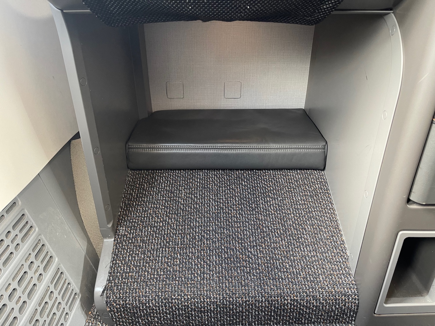 a carpeted seat in a vehicle