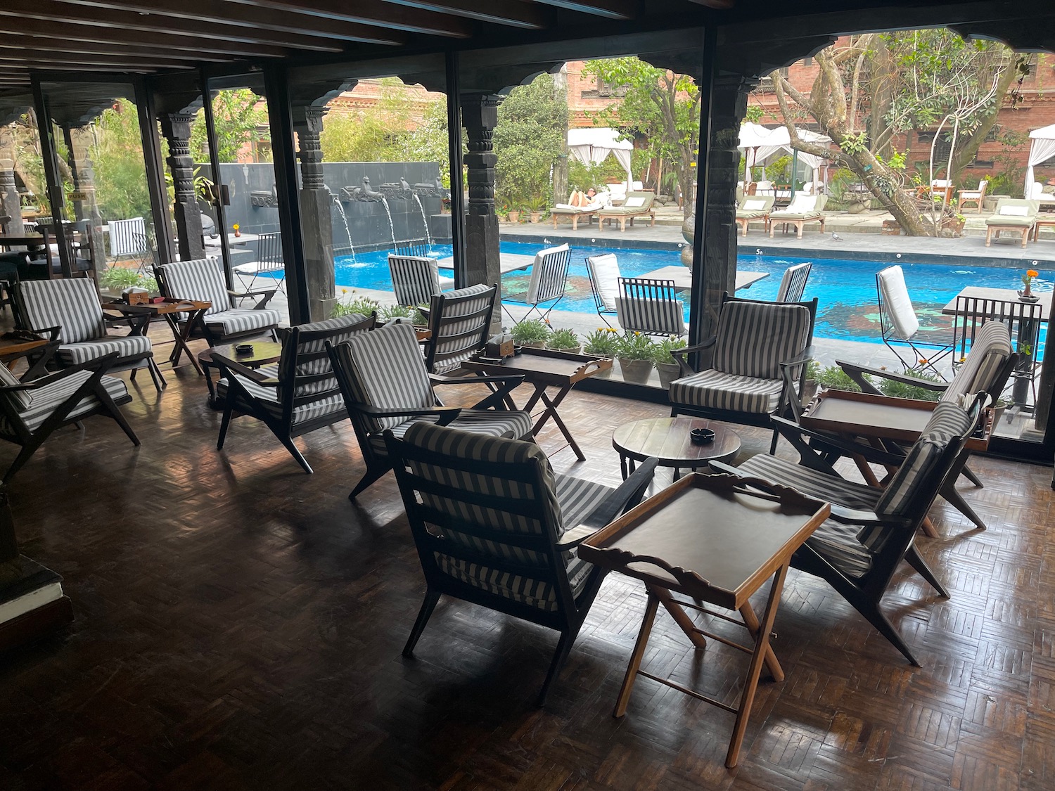 a patio with chairs and tables