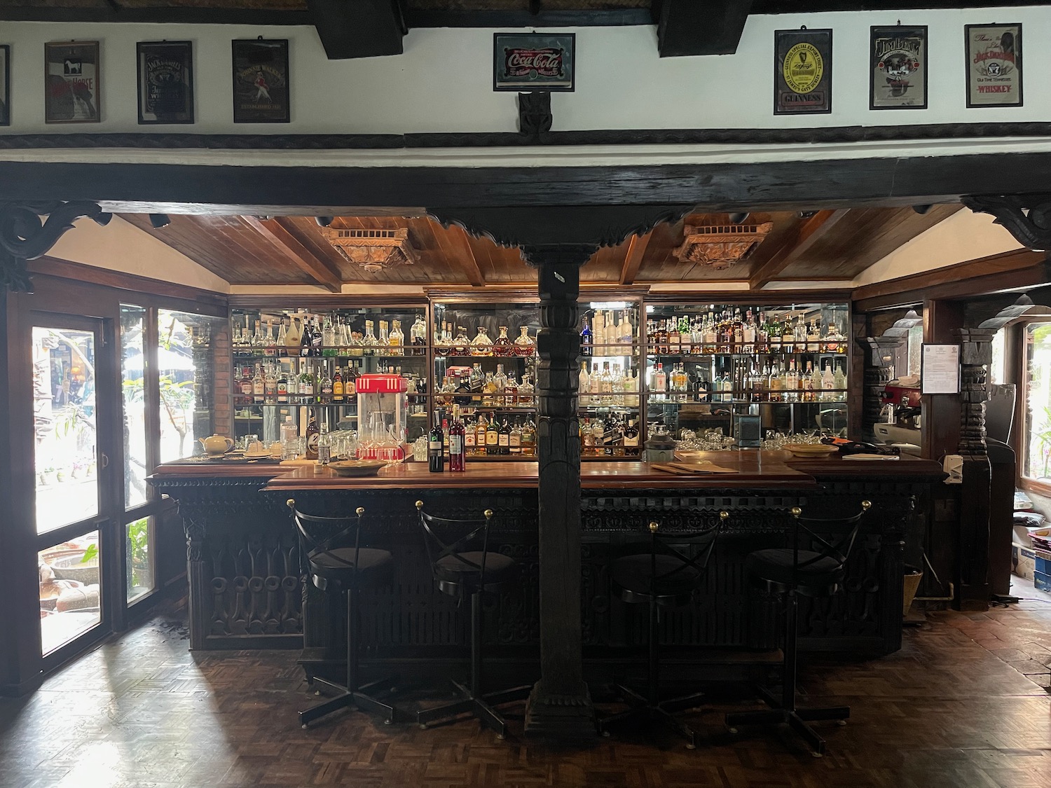 a bar with a shelf of liquor