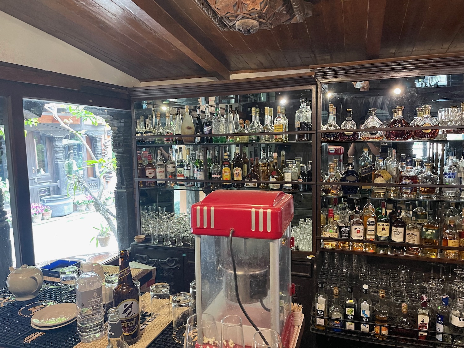 a bar with bottles and glasses