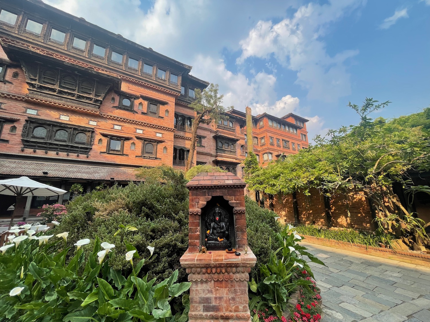 a brick building with a small shrine in front of it