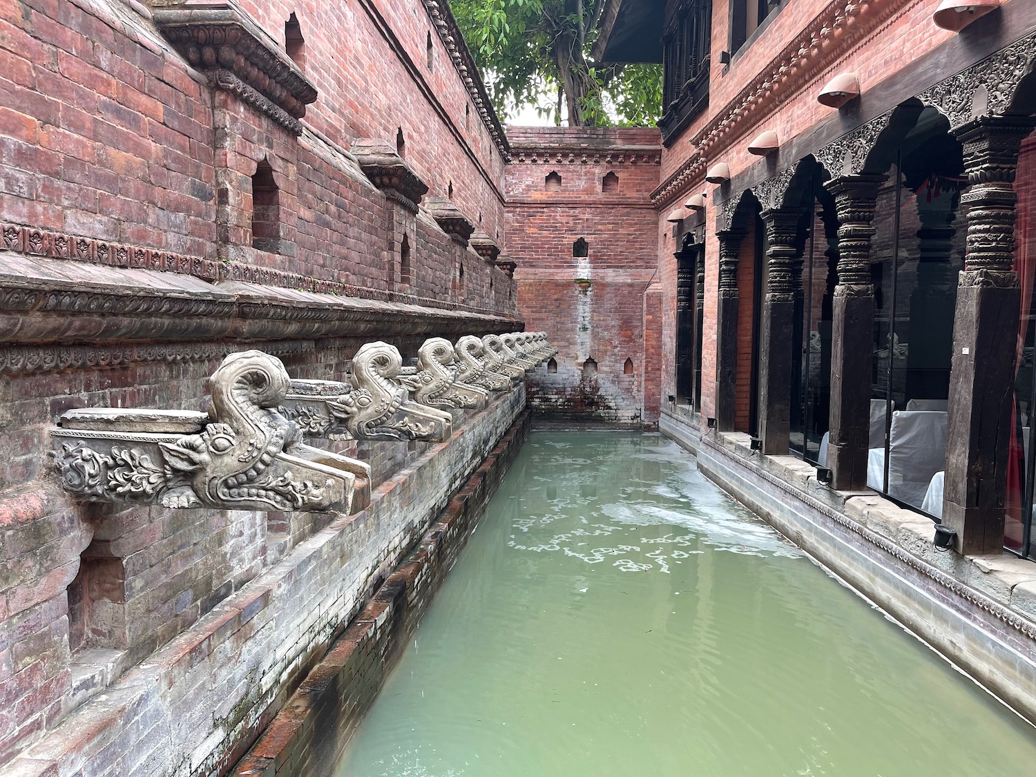 a water fountain in a courtyard