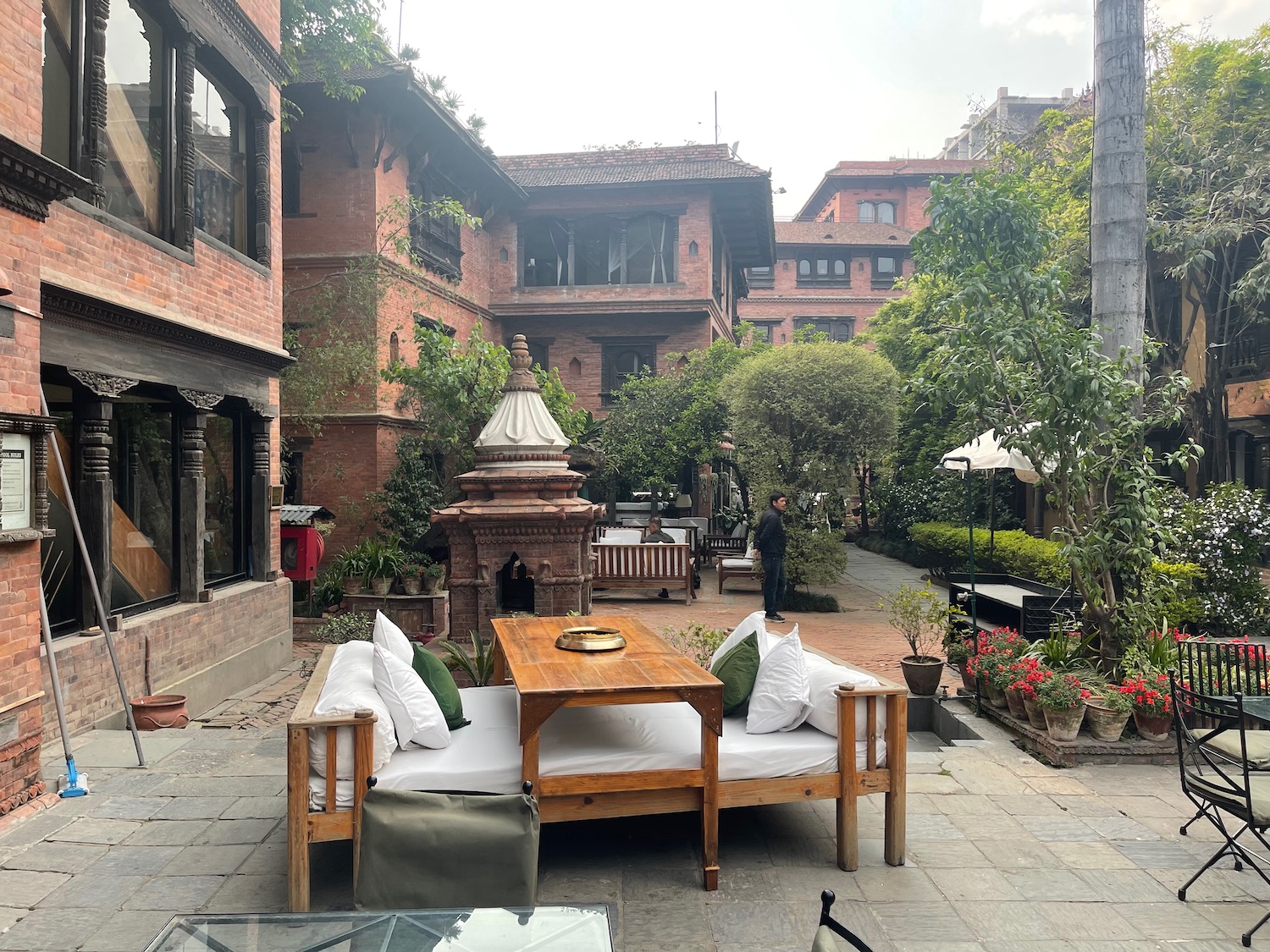 a patio with a table and chairs