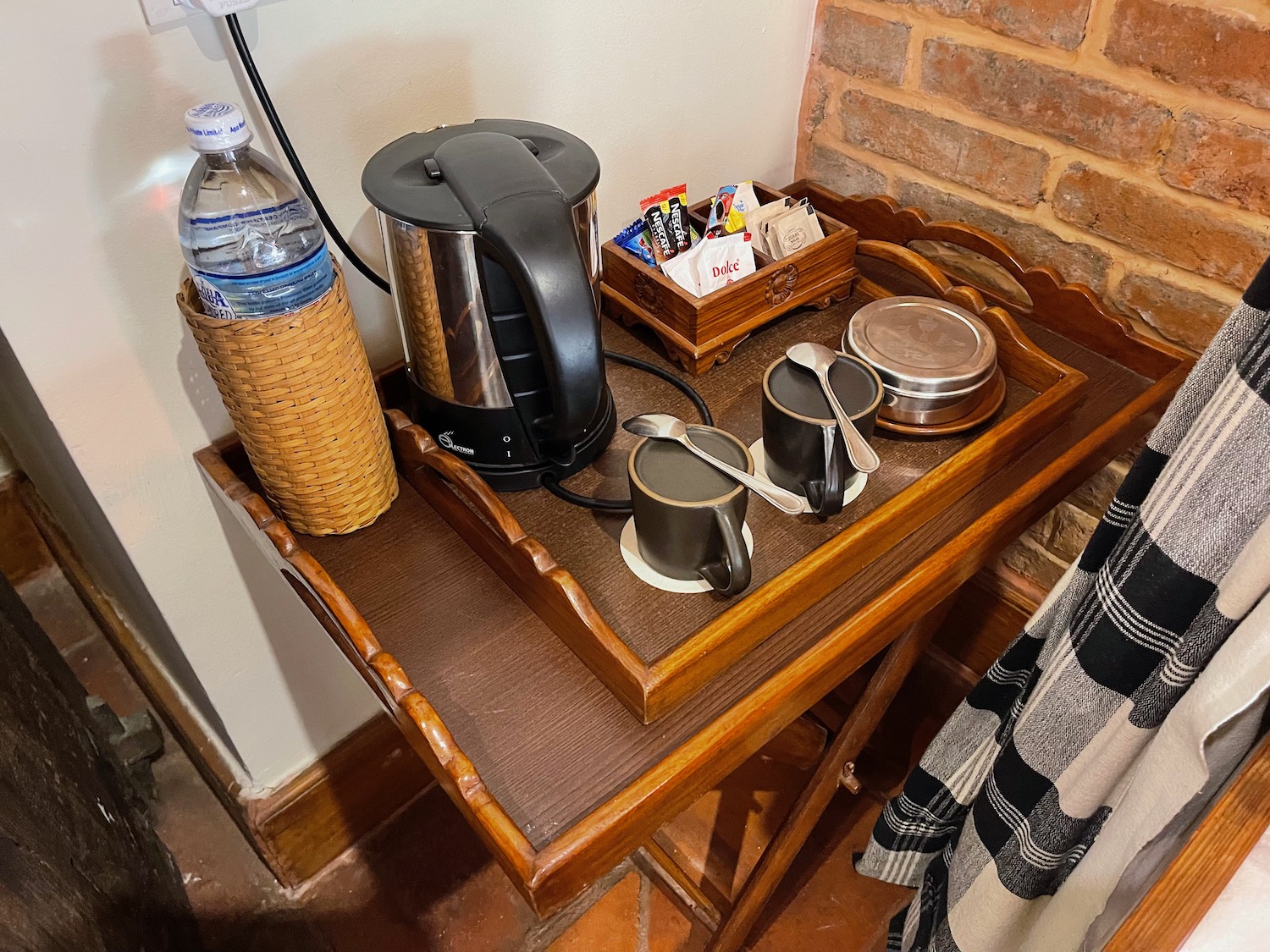 a tray with a coffee pot and cups on it