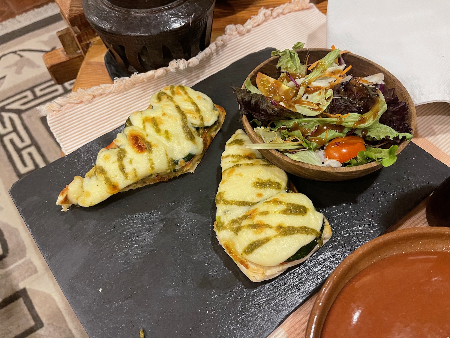 a plate of food and a bowl of salad