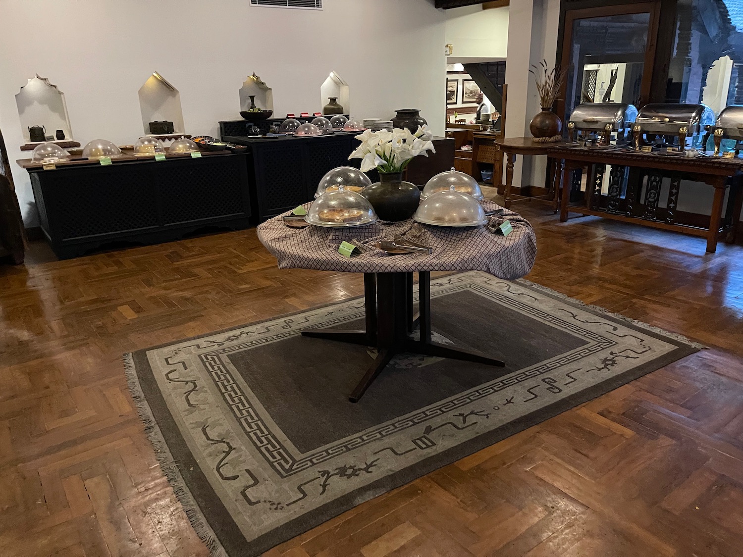 a table with food cloches on it