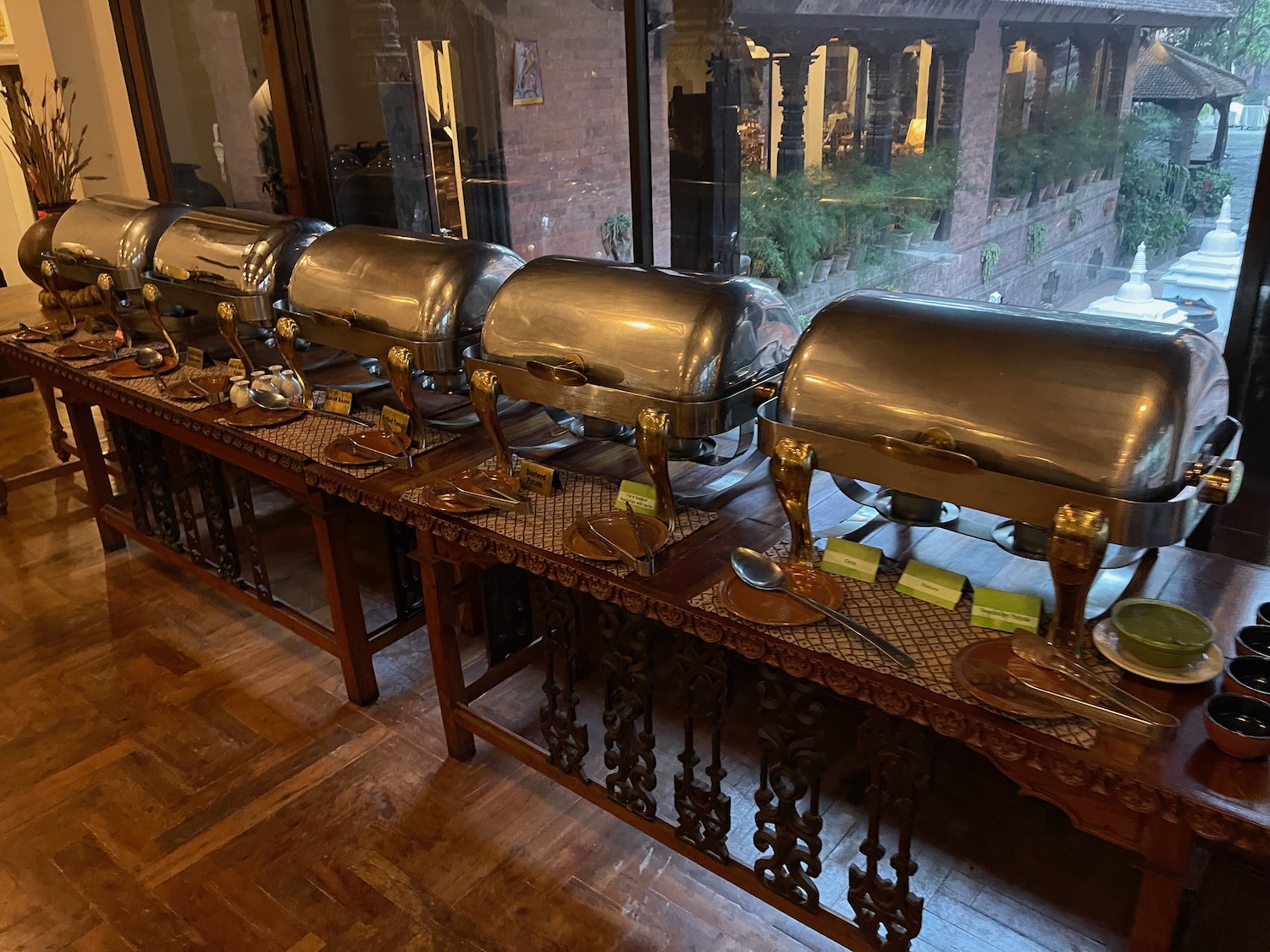 a row of silver containers on a table