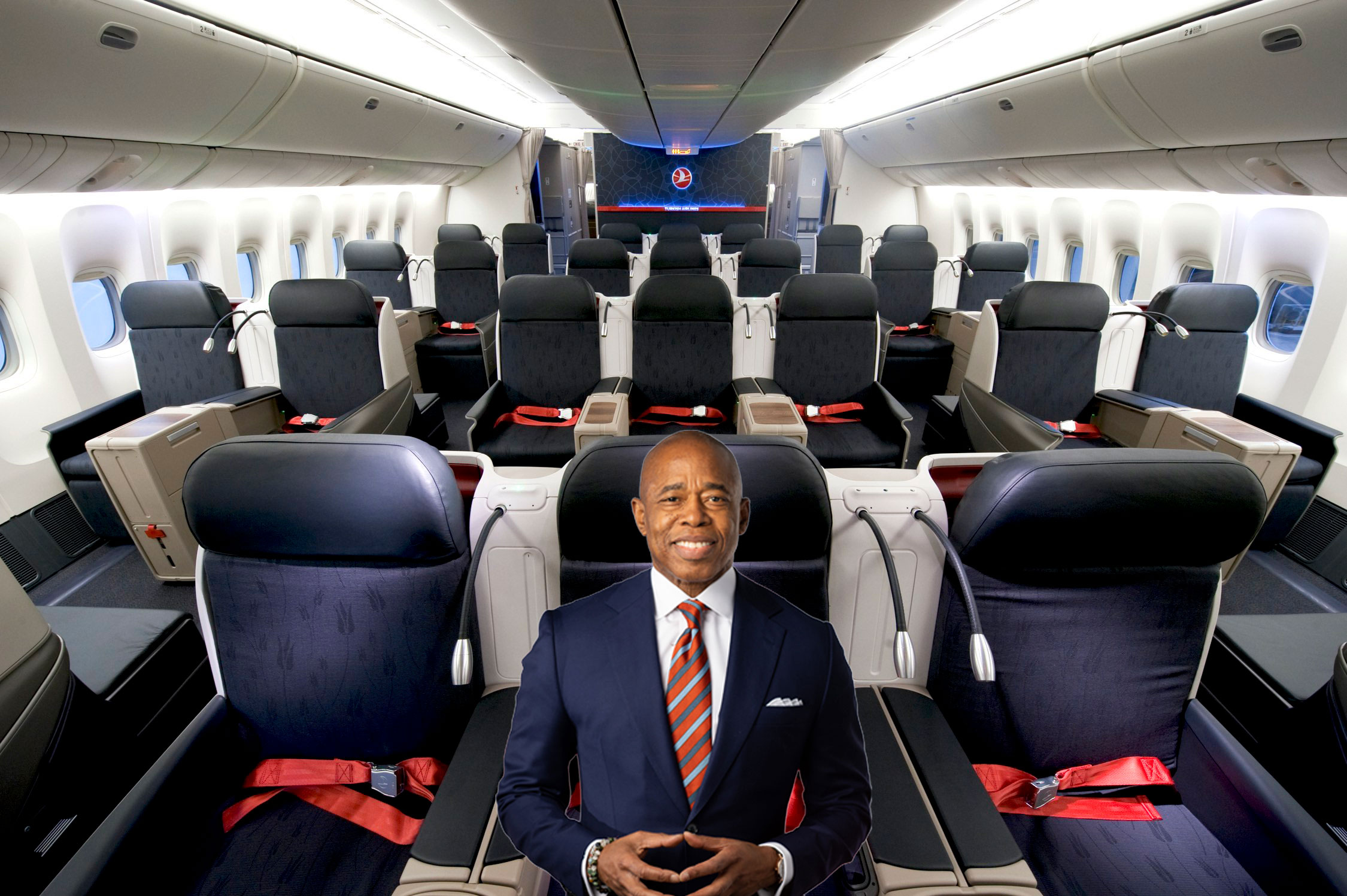 a man in a suit and tie in an airplane