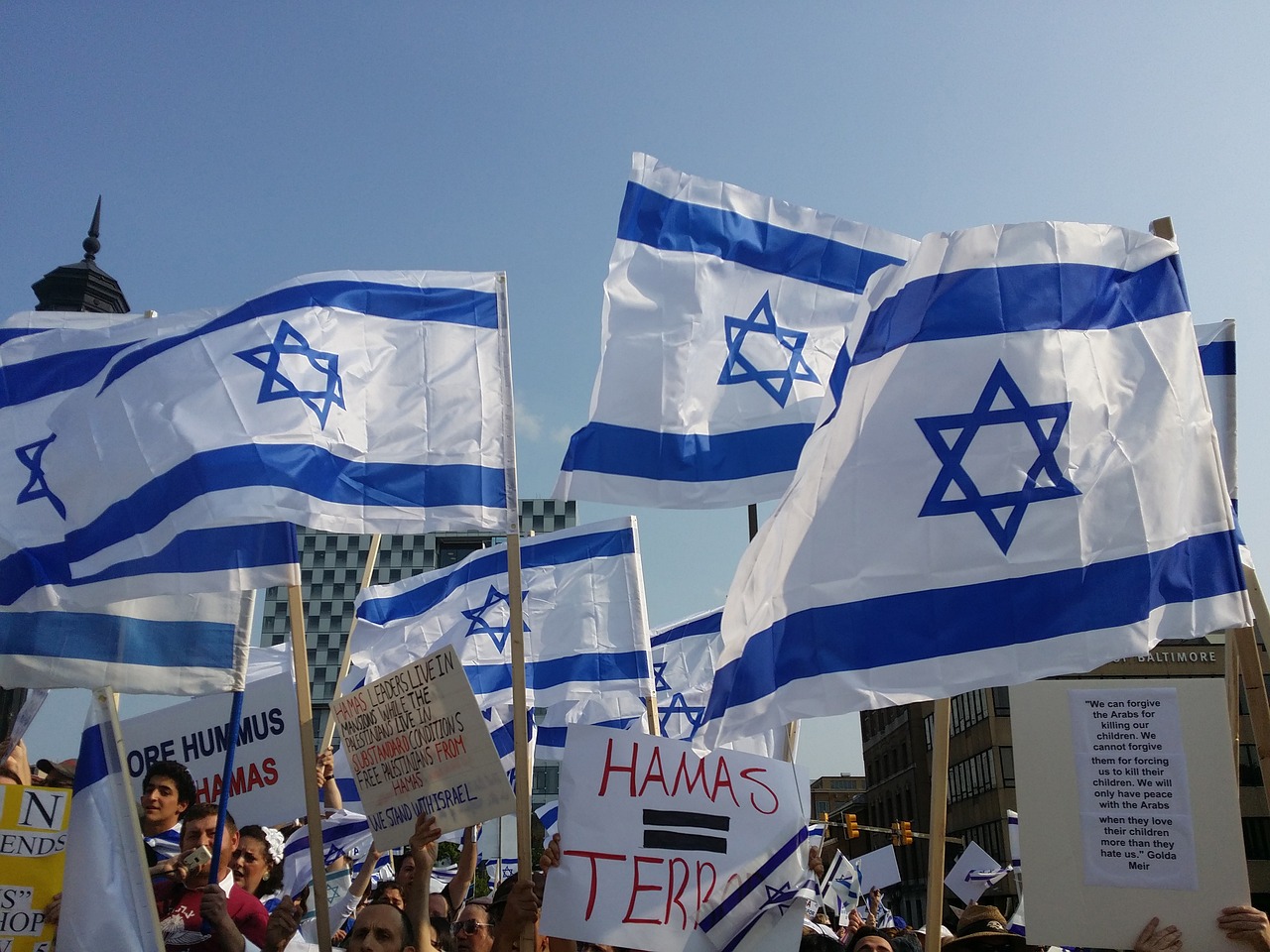 a group of people holding flags