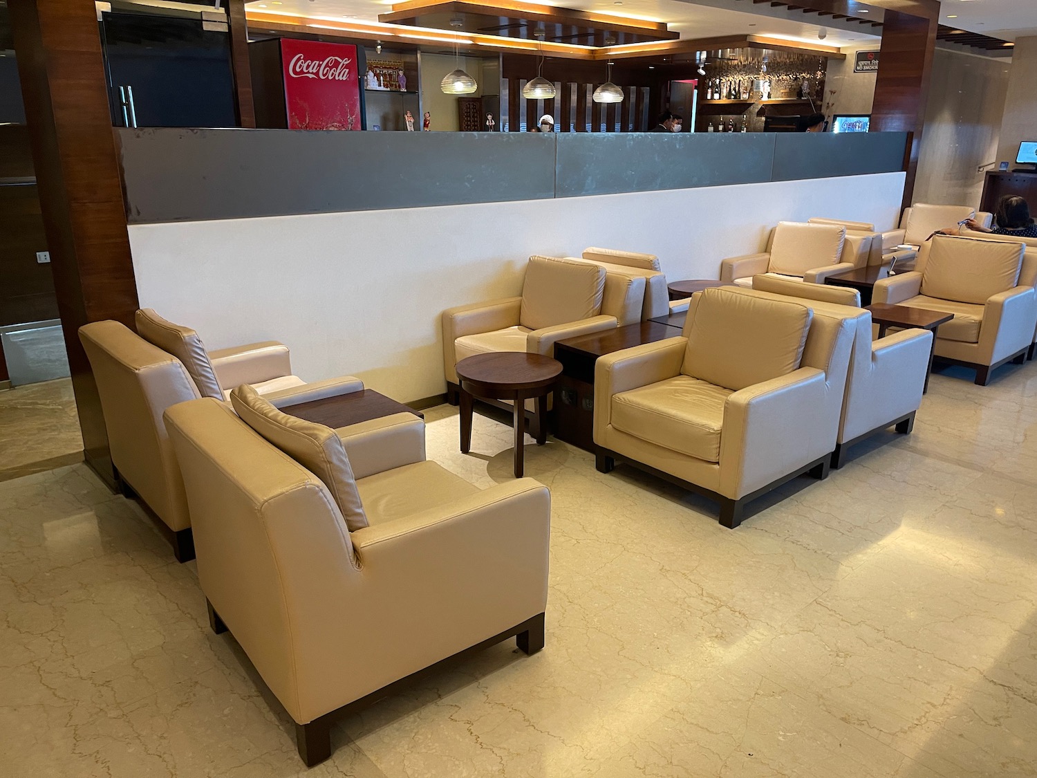 a group of chairs and tables in a room