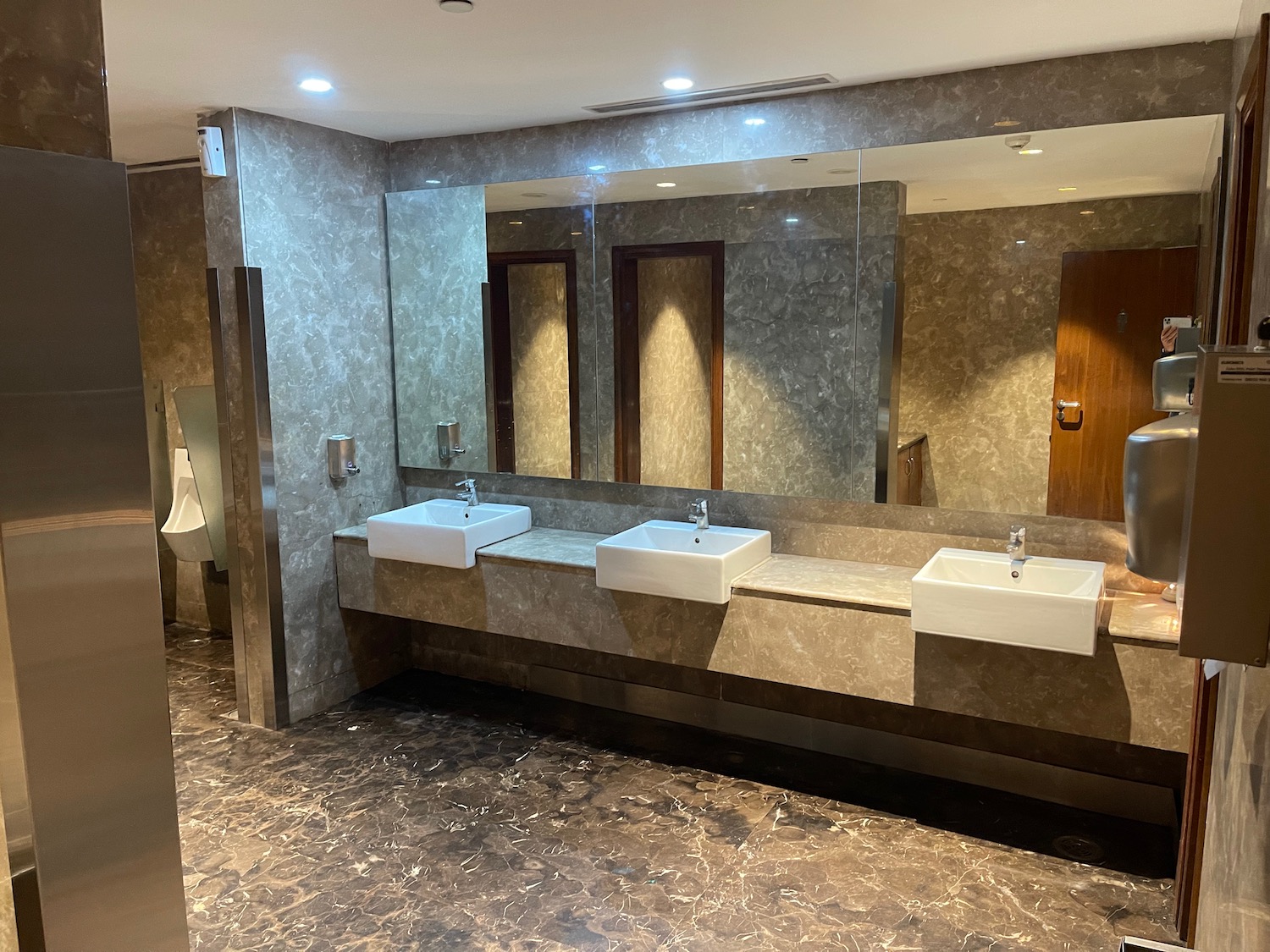 a bathroom with sinks and a large mirror