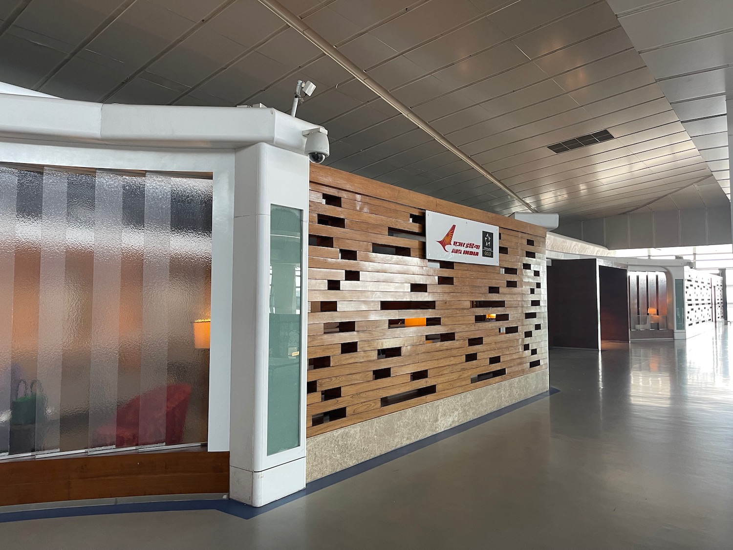 a wall with wood panels and a sign in a building