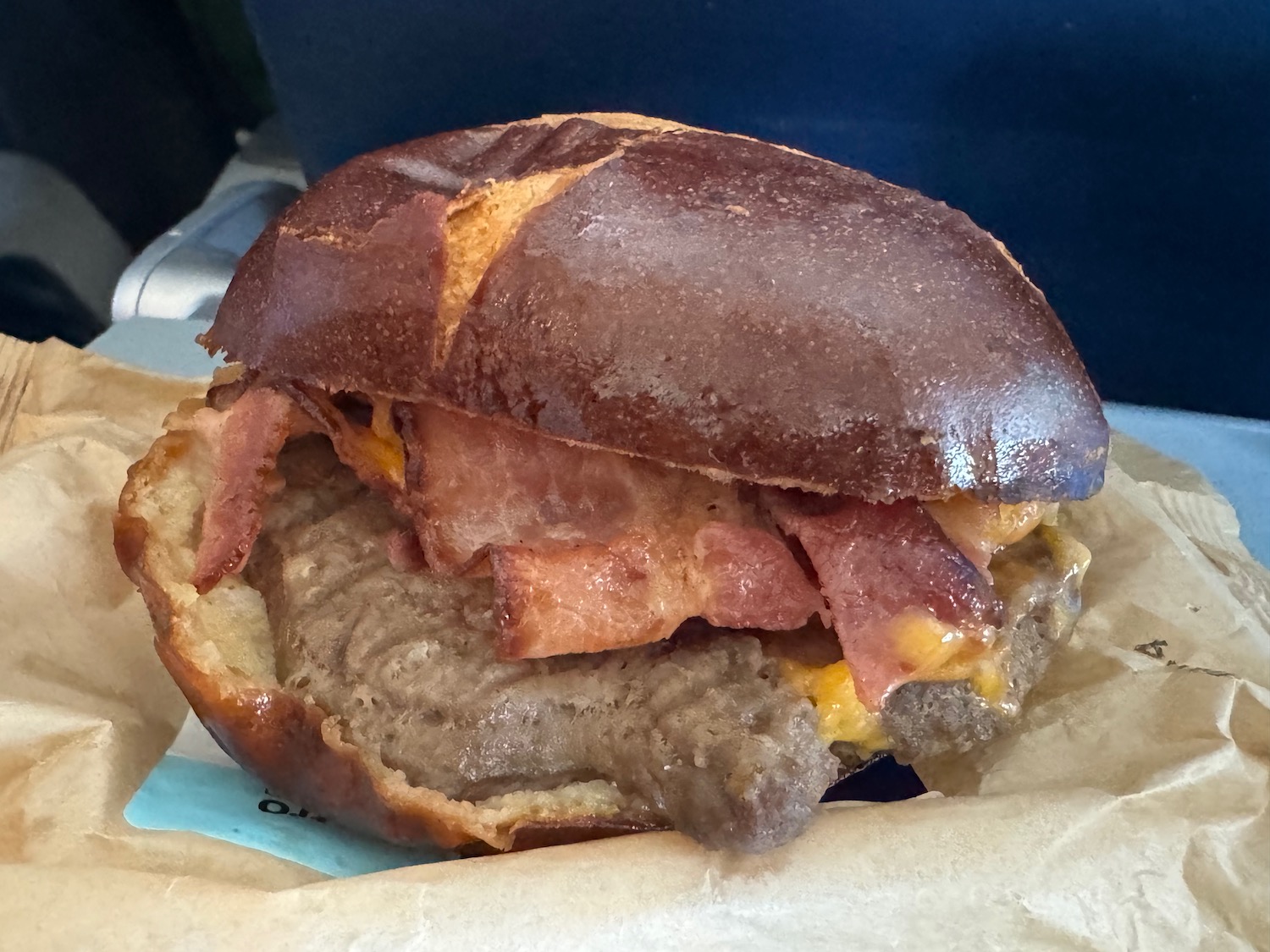 a burger with bacon and cheese