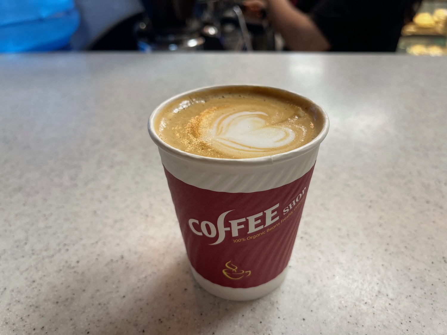 a cup of coffee with a heart shaped foam in it