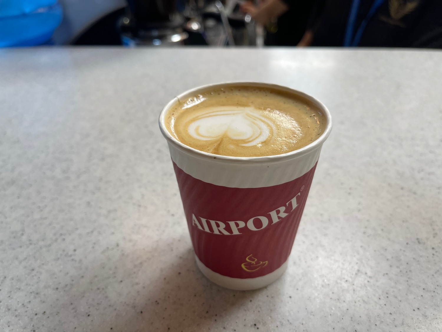 a cup of coffee with a heart shaped foam in it