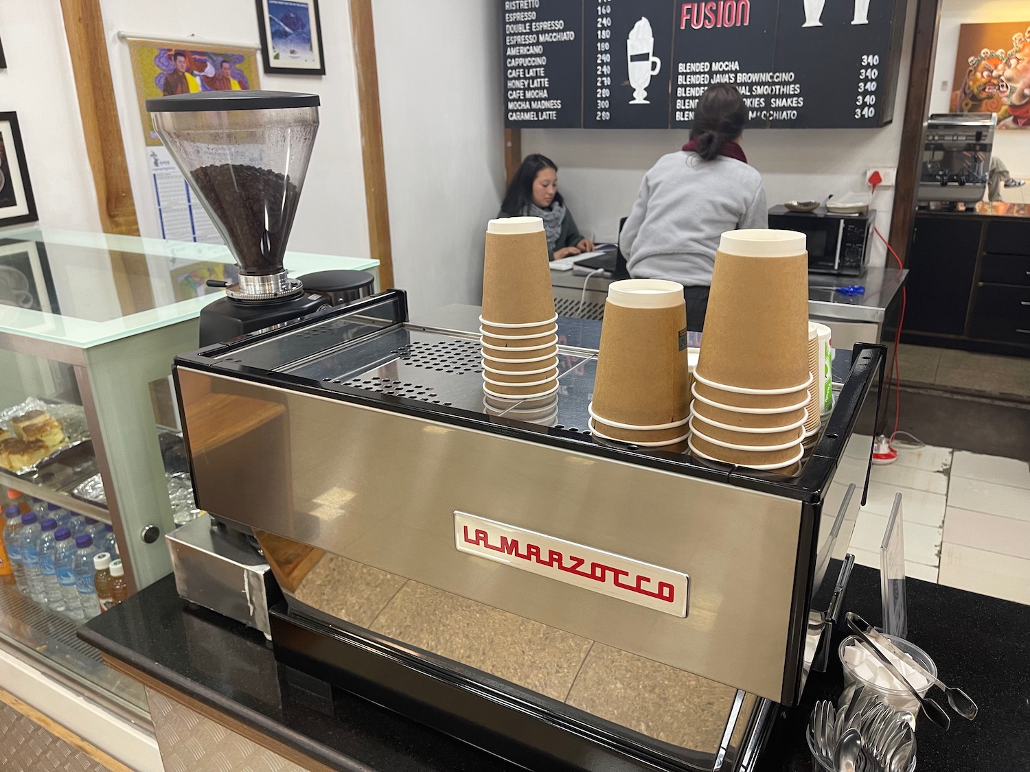 a coffee machine with cups on top