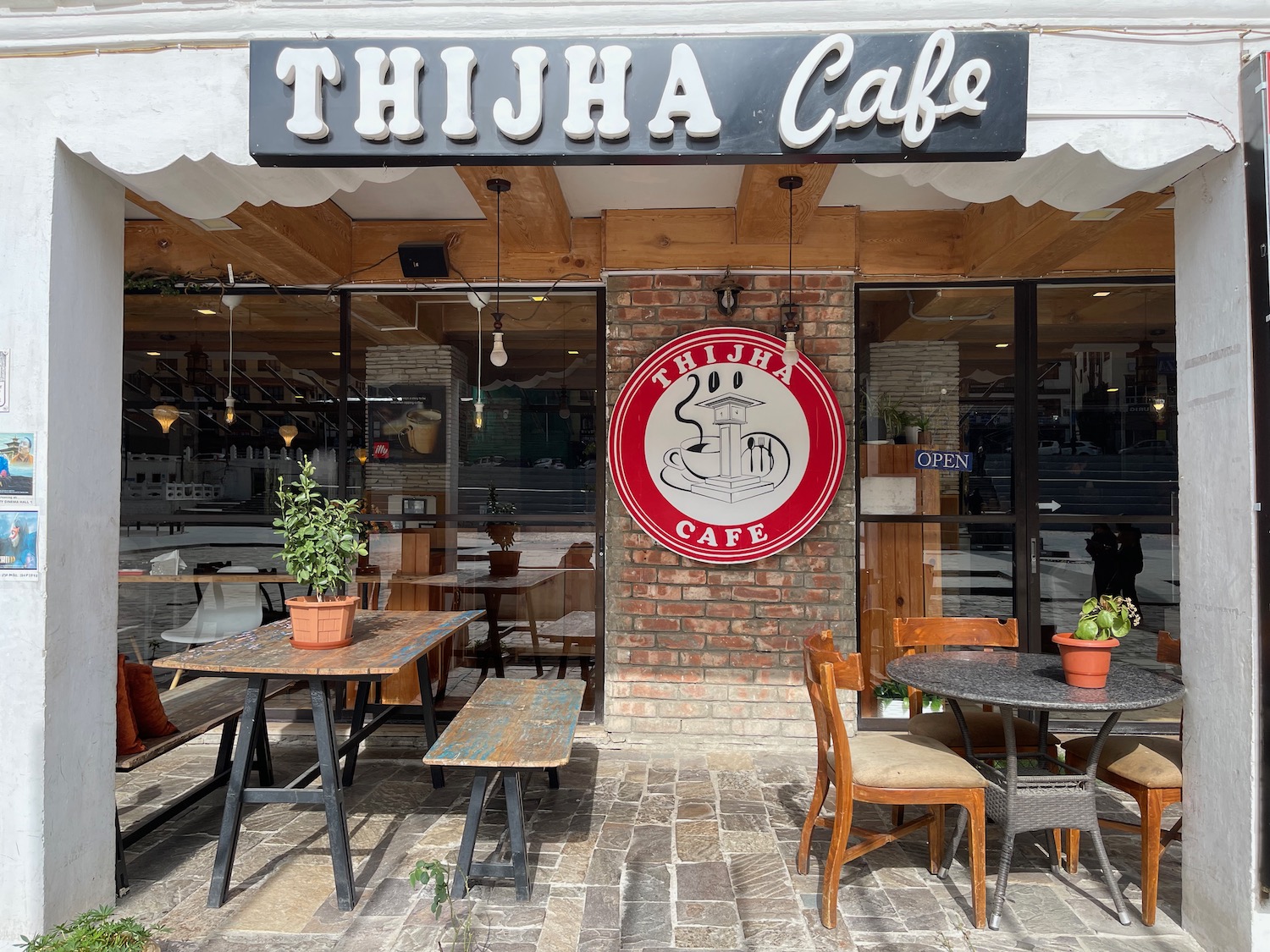 a restaurant with tables and chairs