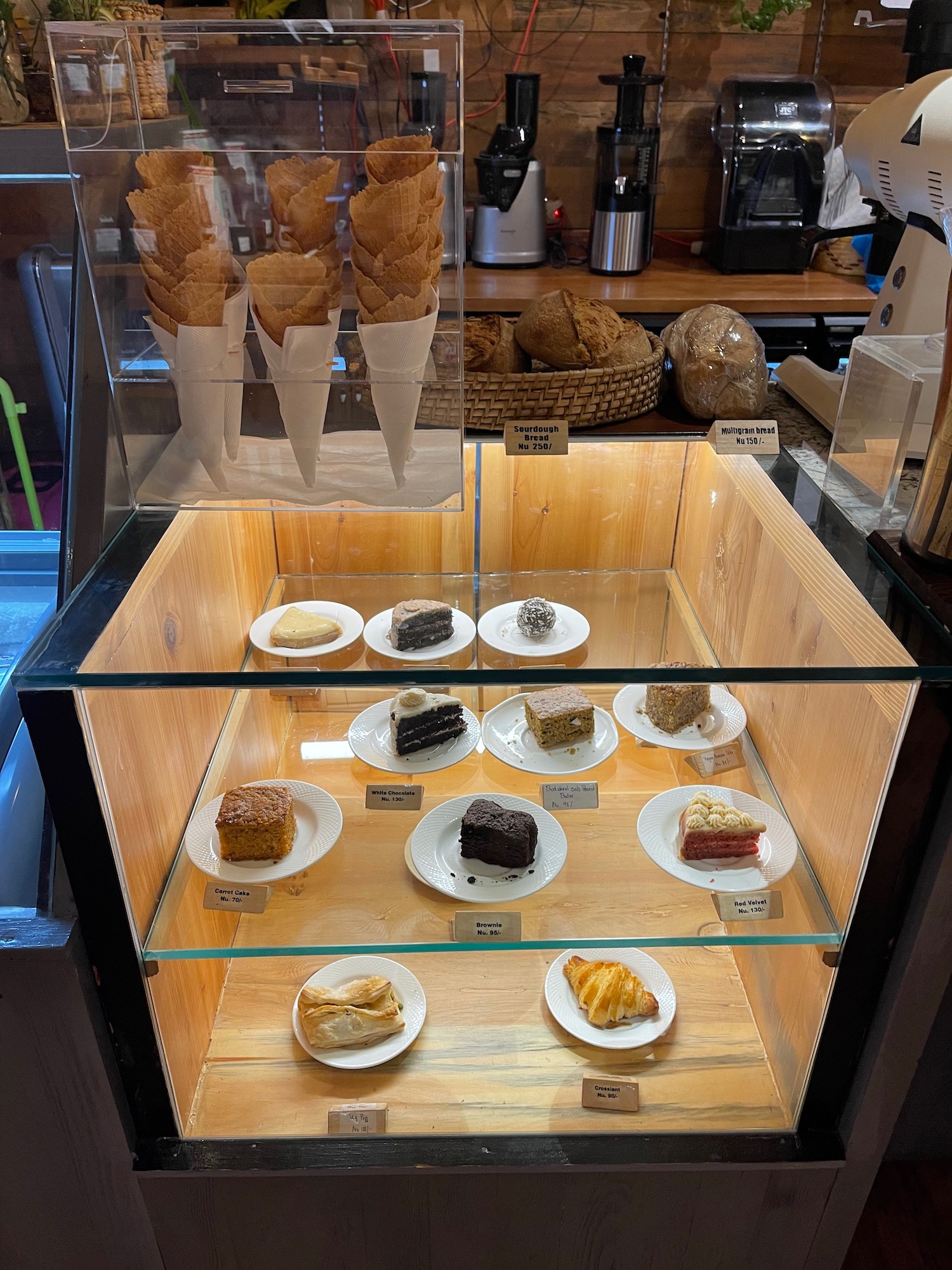 a display case with pastries and pastries