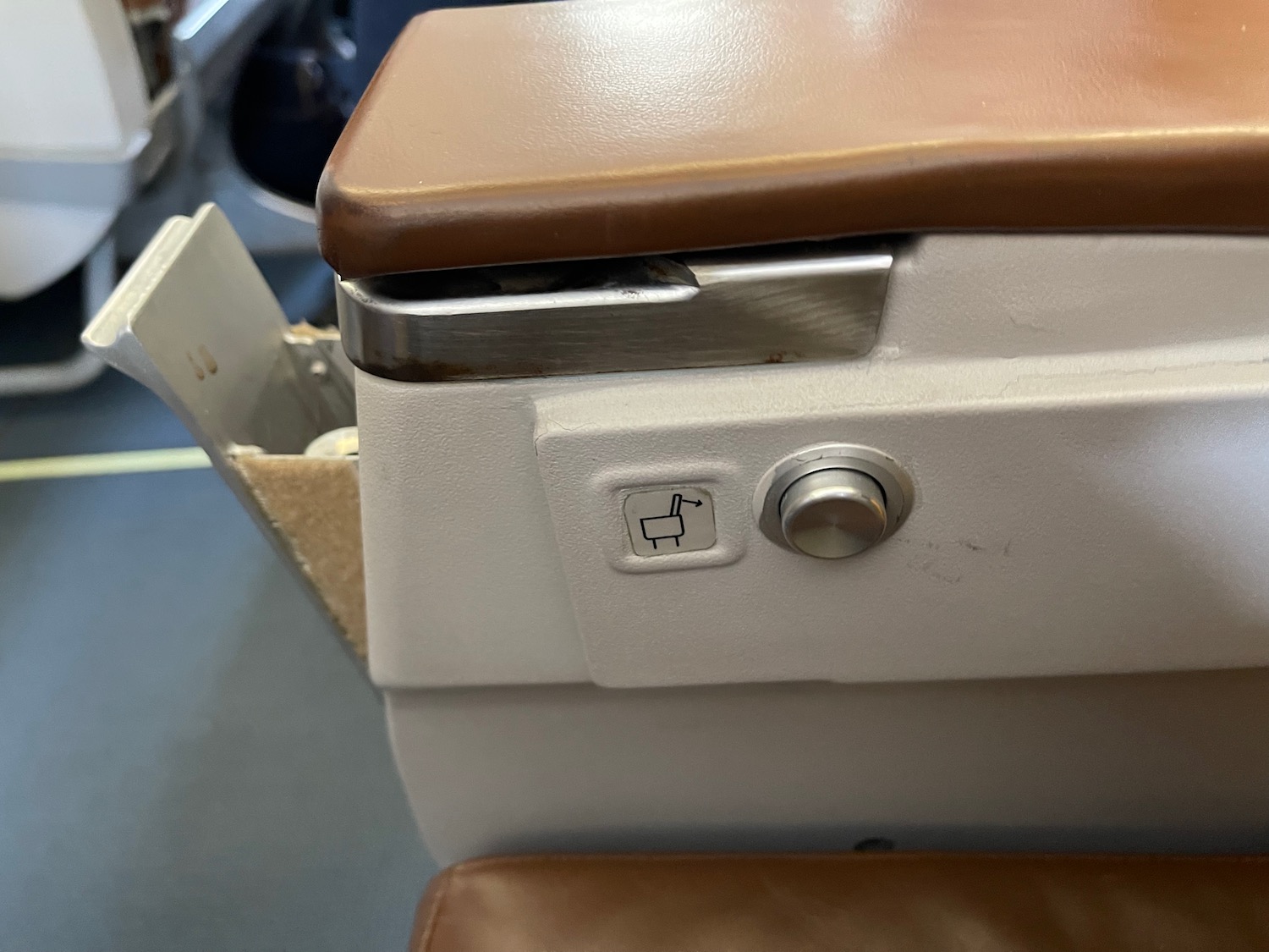 a seat with a seat button and a seat open