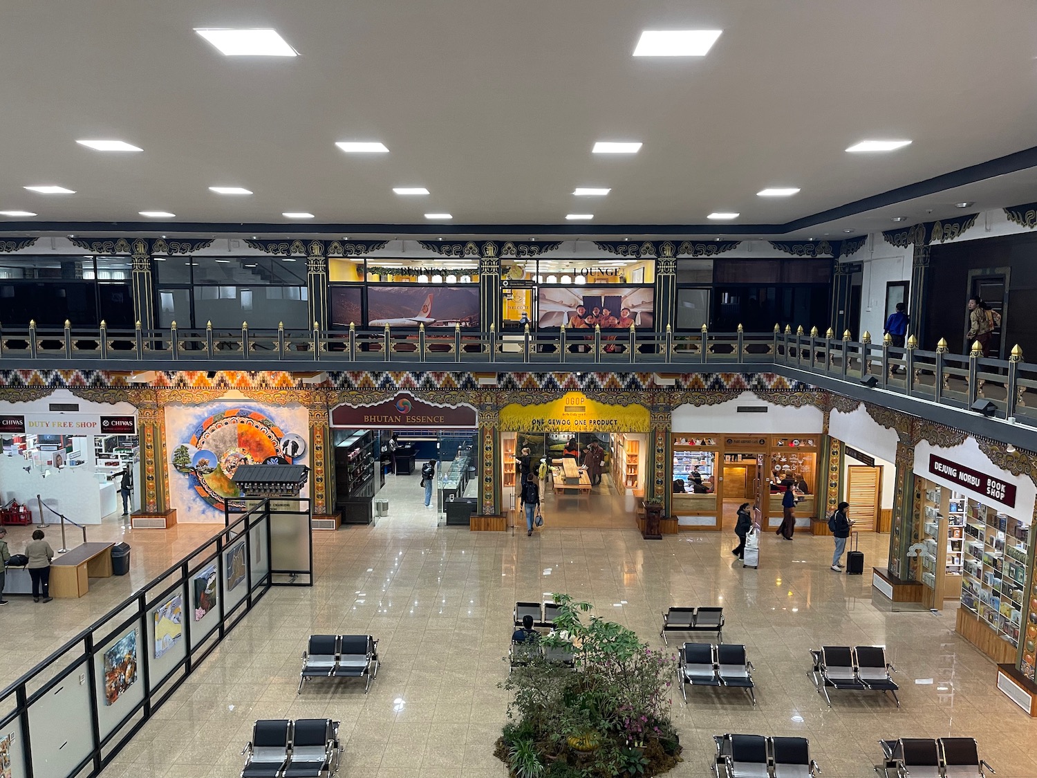 a large building with many chairs and a balcony