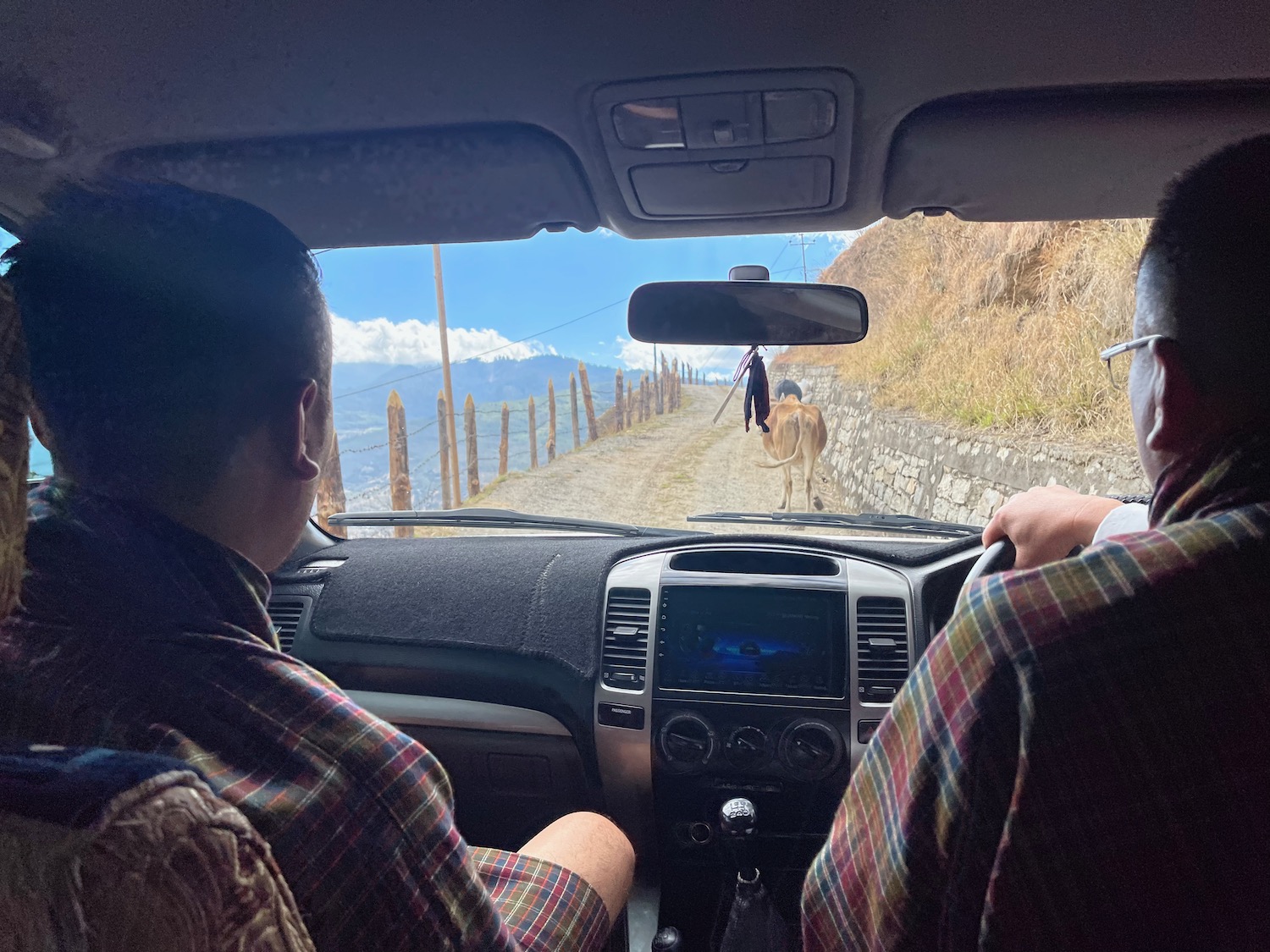 a couple of men in a car