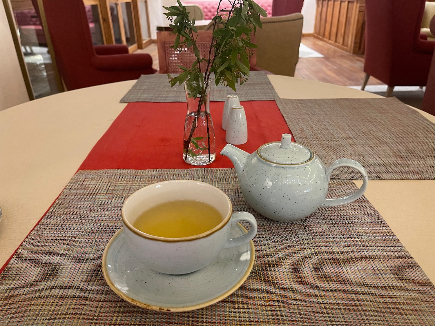 a teapot and cup on a table