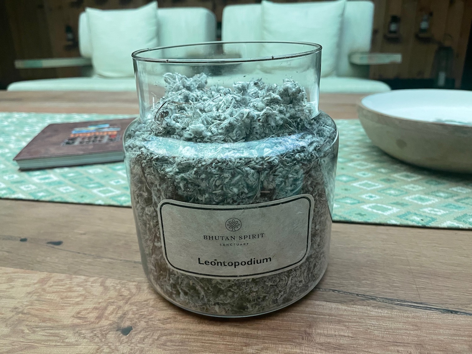 a glass jar with a white label on it