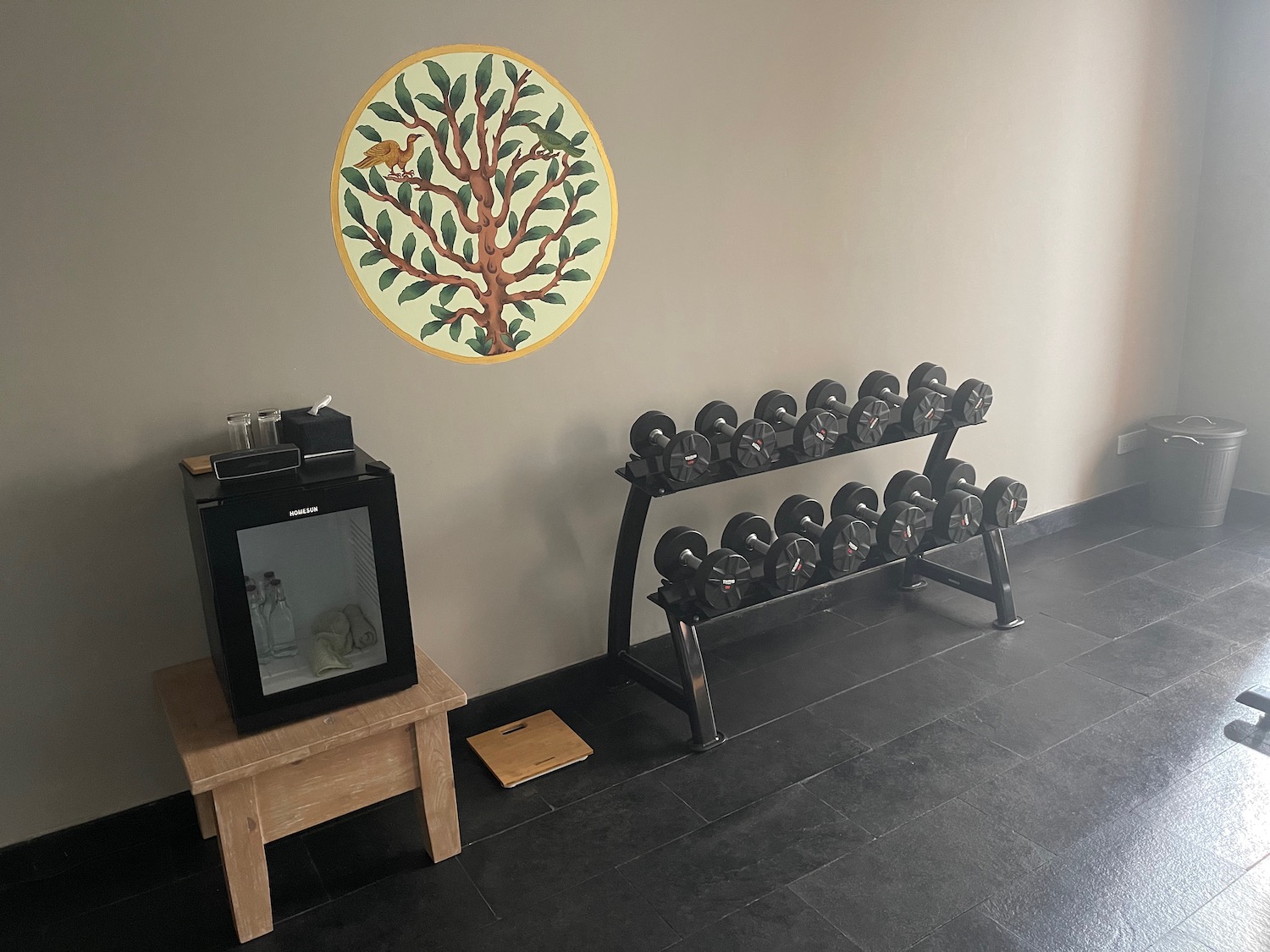 a room with weights on a stand