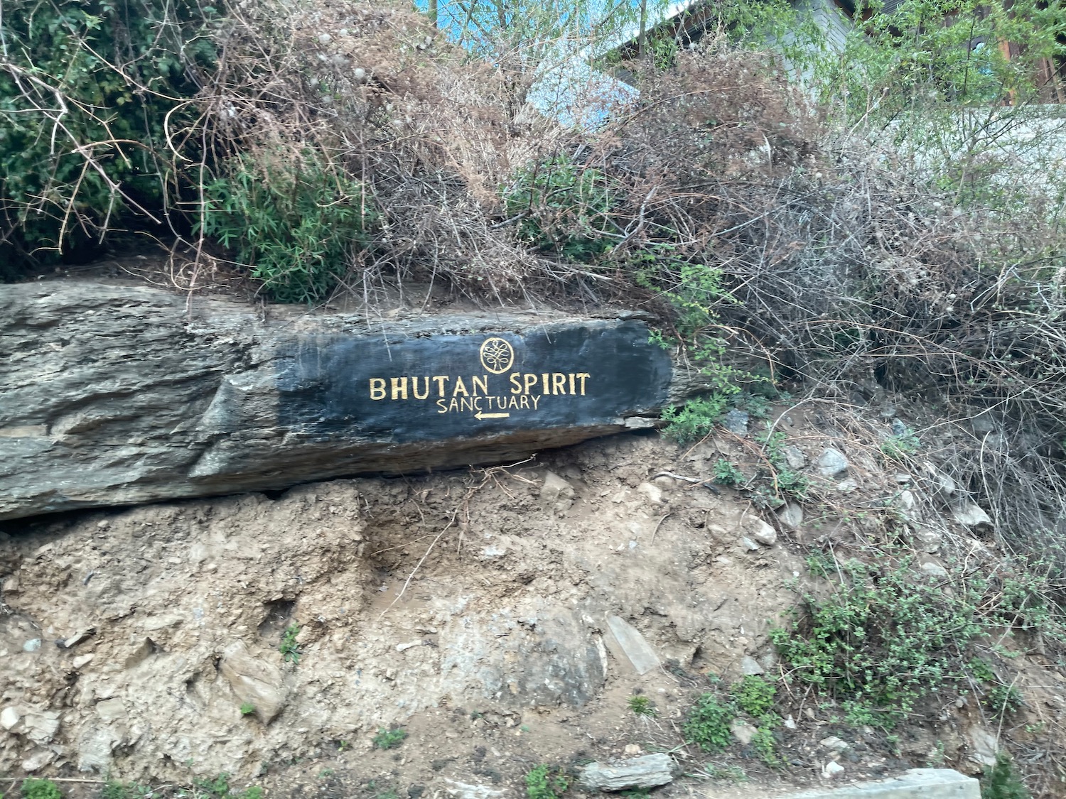 a sign on a rock