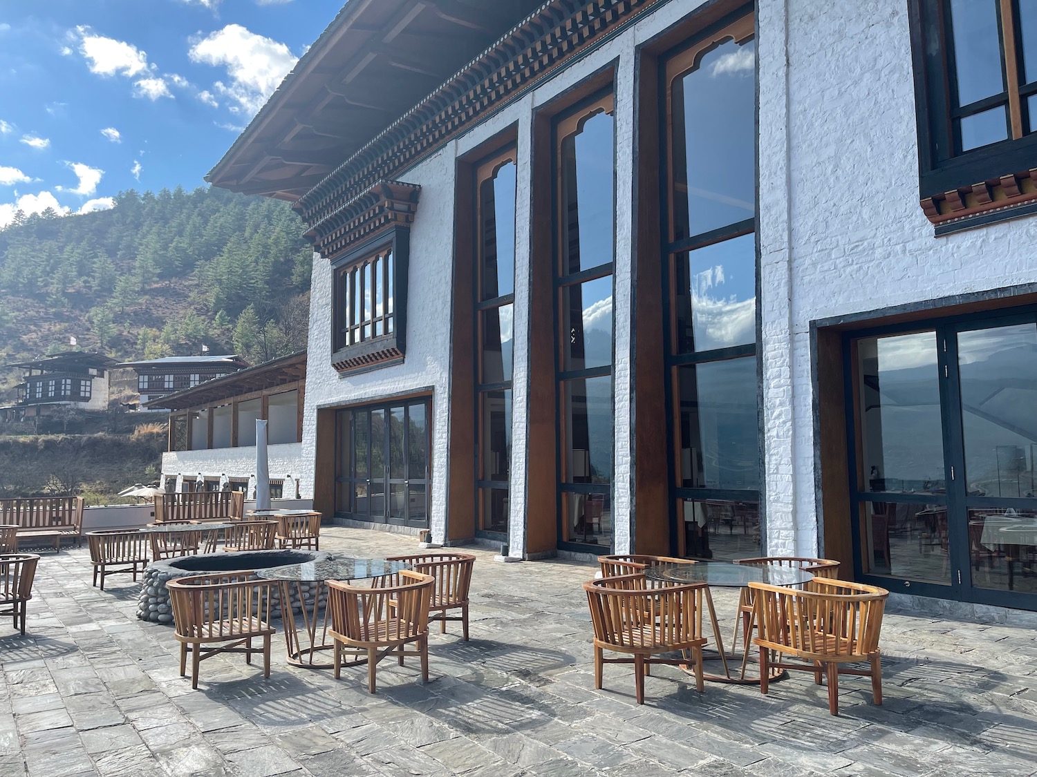 a building with tables and chairs outside