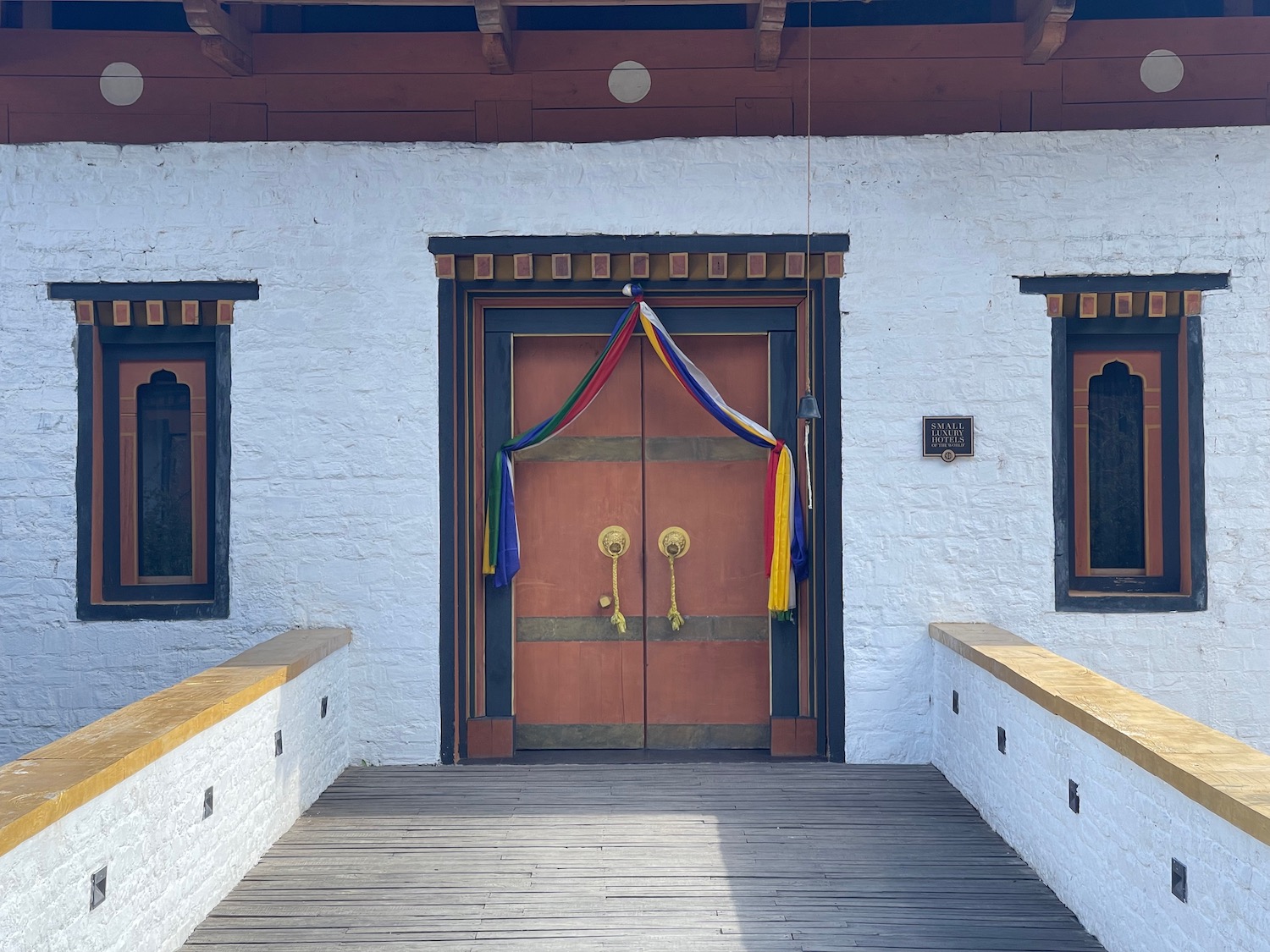 a wooden door with colorful ribbons on it