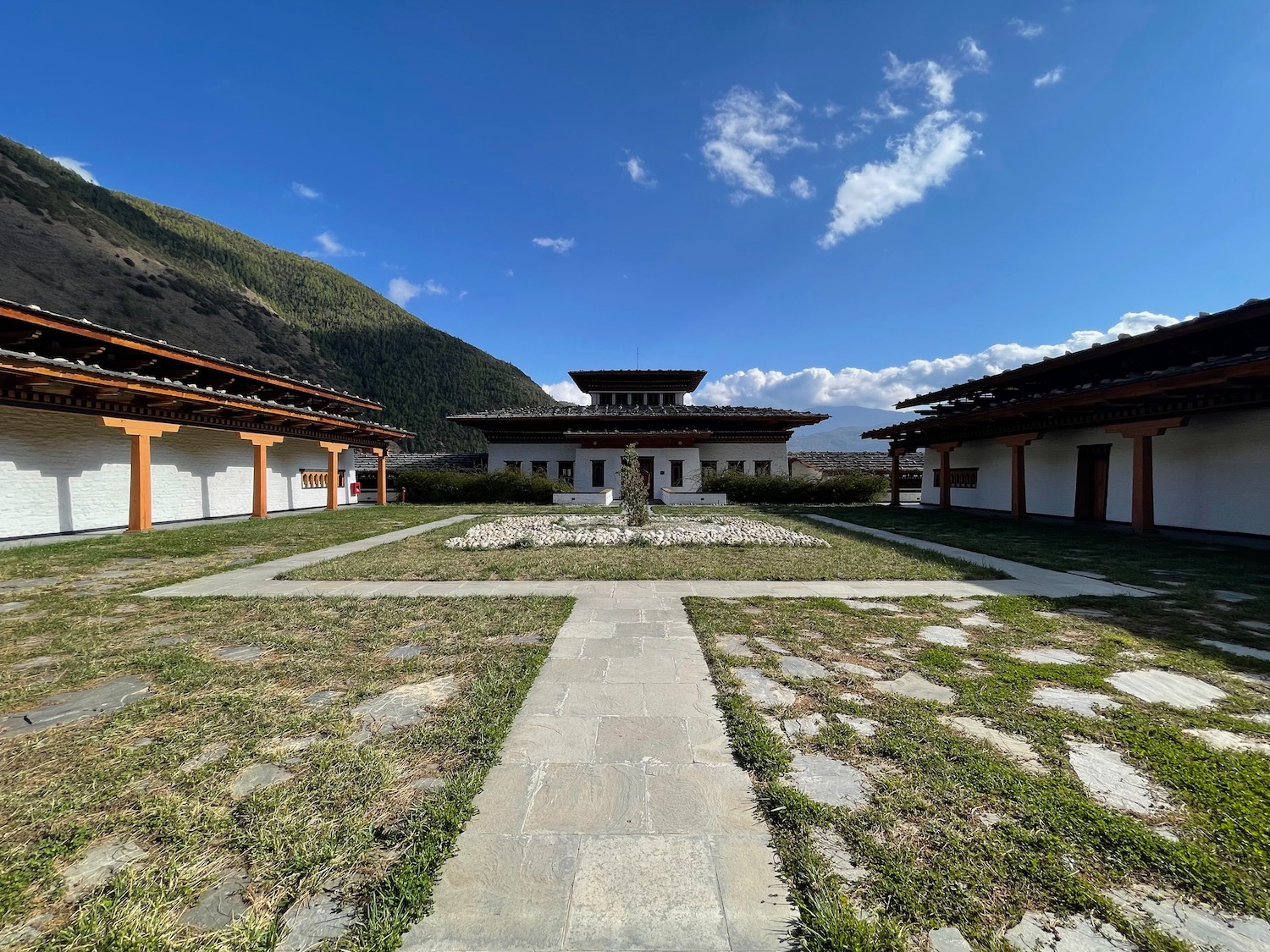 a building with a lawn and grass