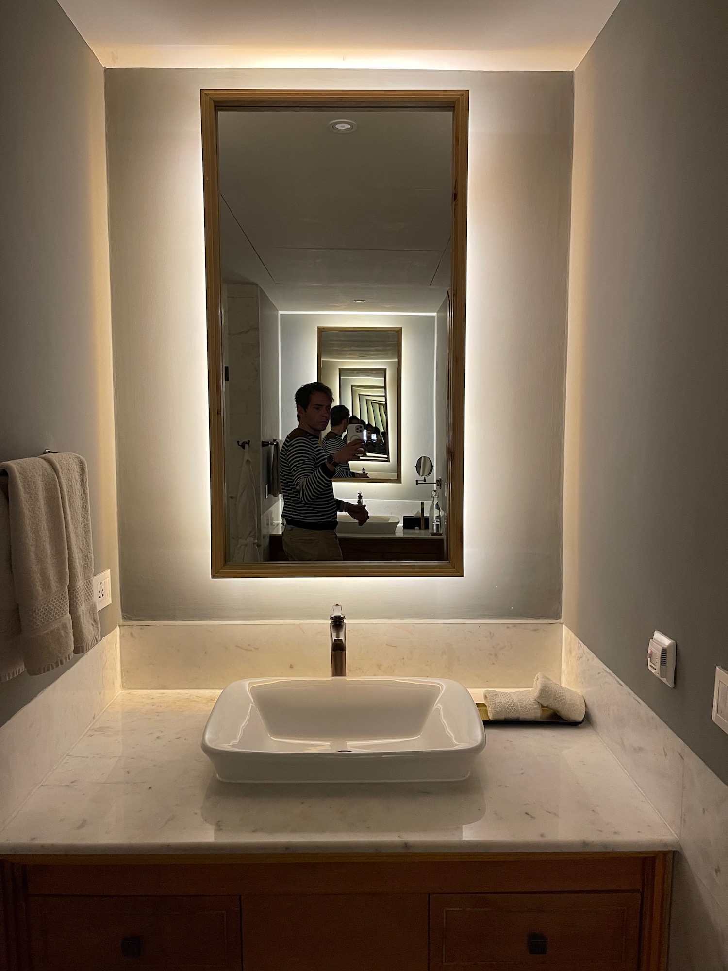 a mirror above a sink