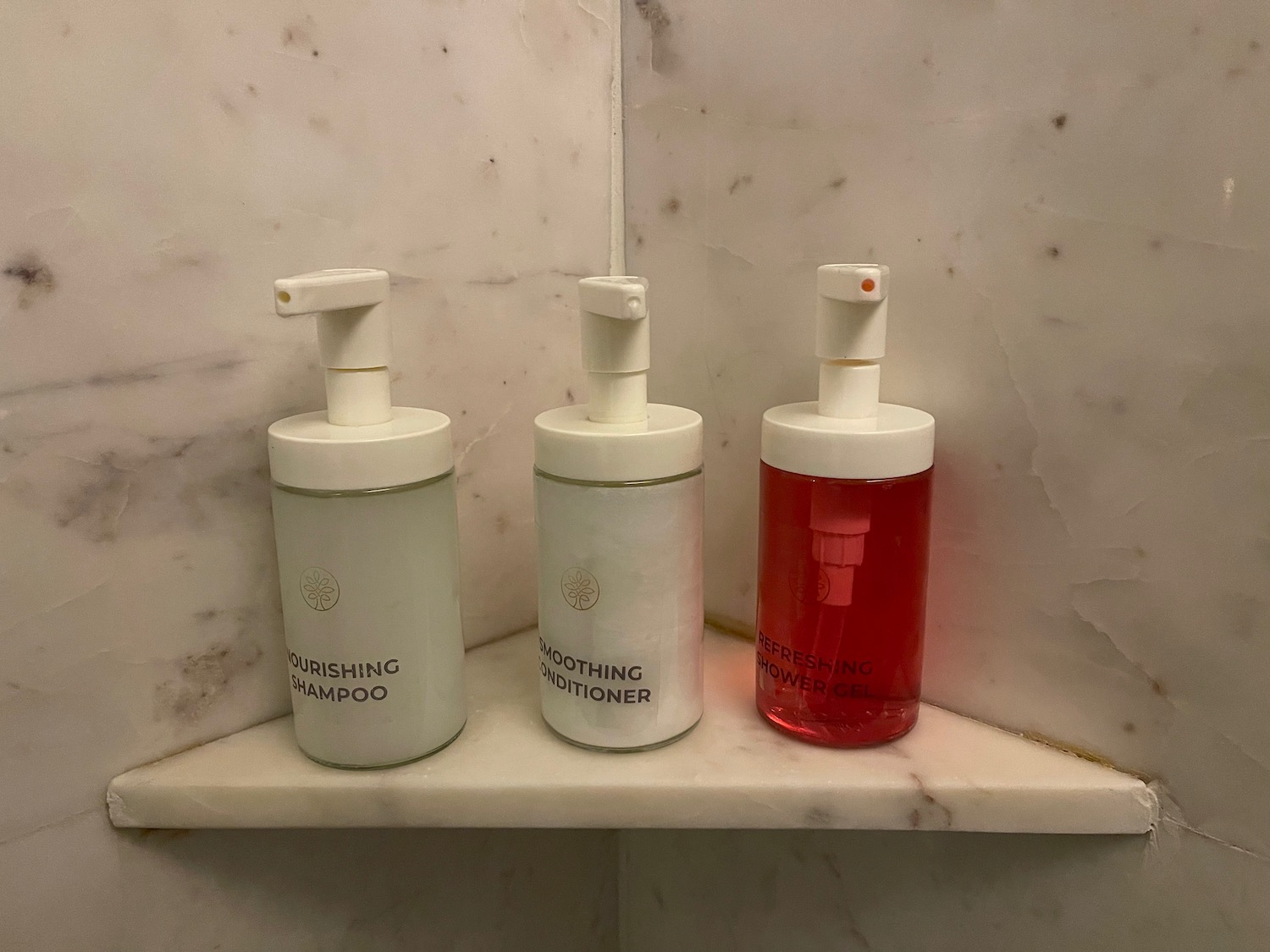 a group of soap dispensers on a shelf