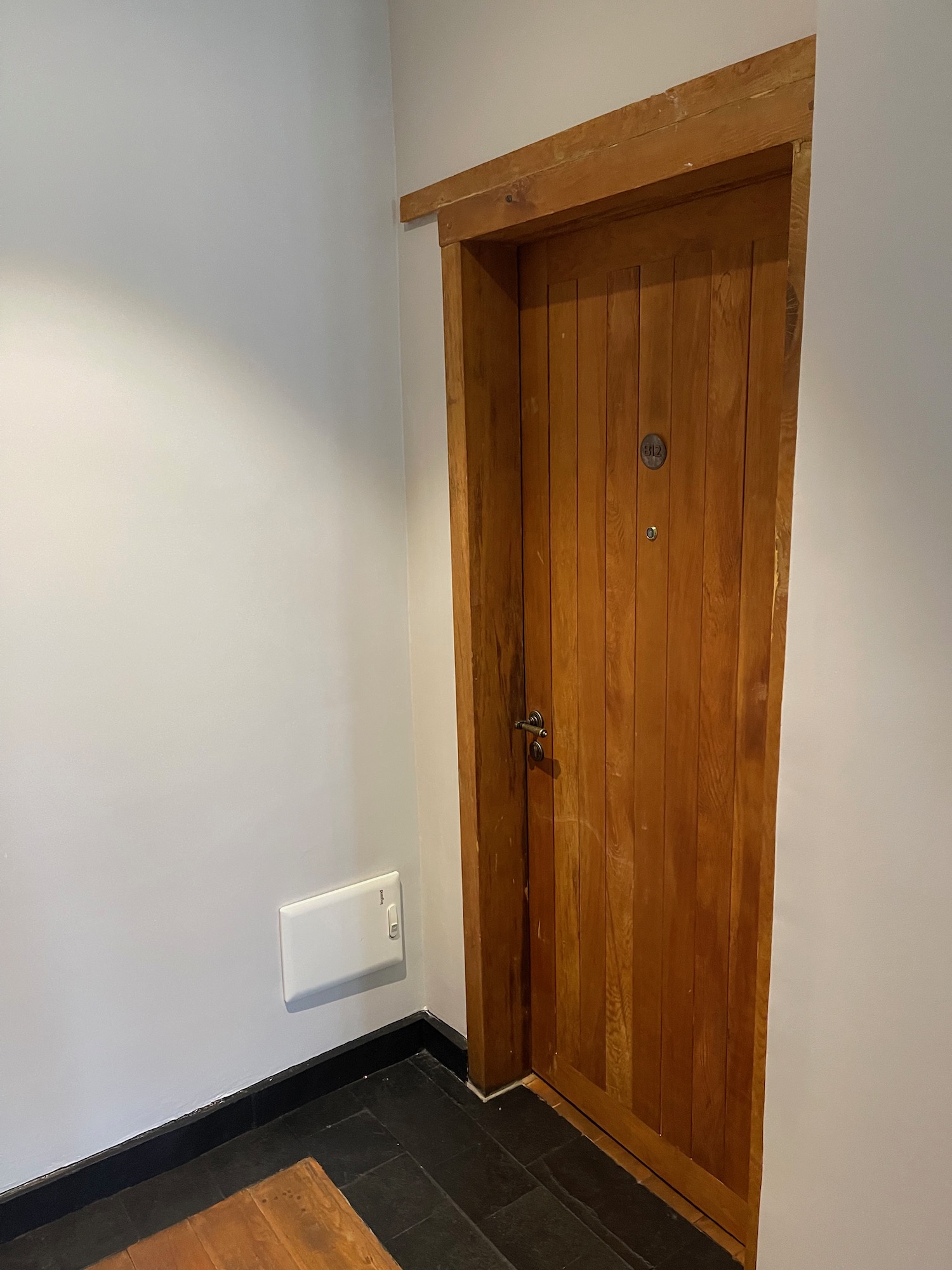 a wooden door in a room