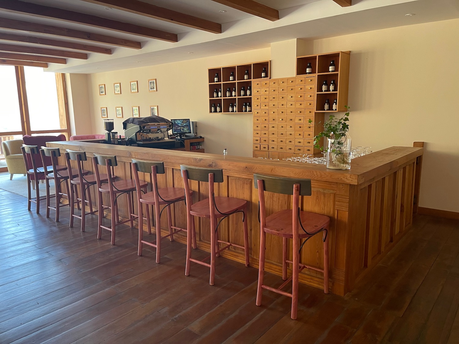 a bar with chairs in a room