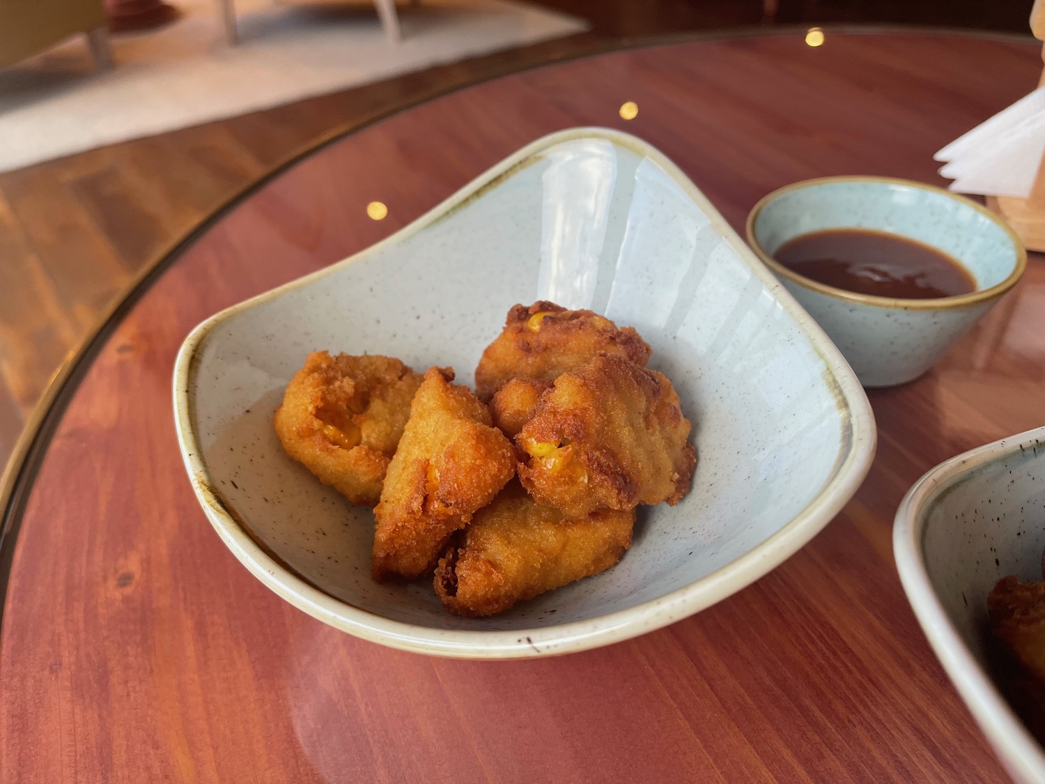 a bowl of fried food on a table