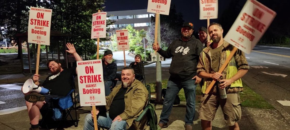 a group of people holding signs