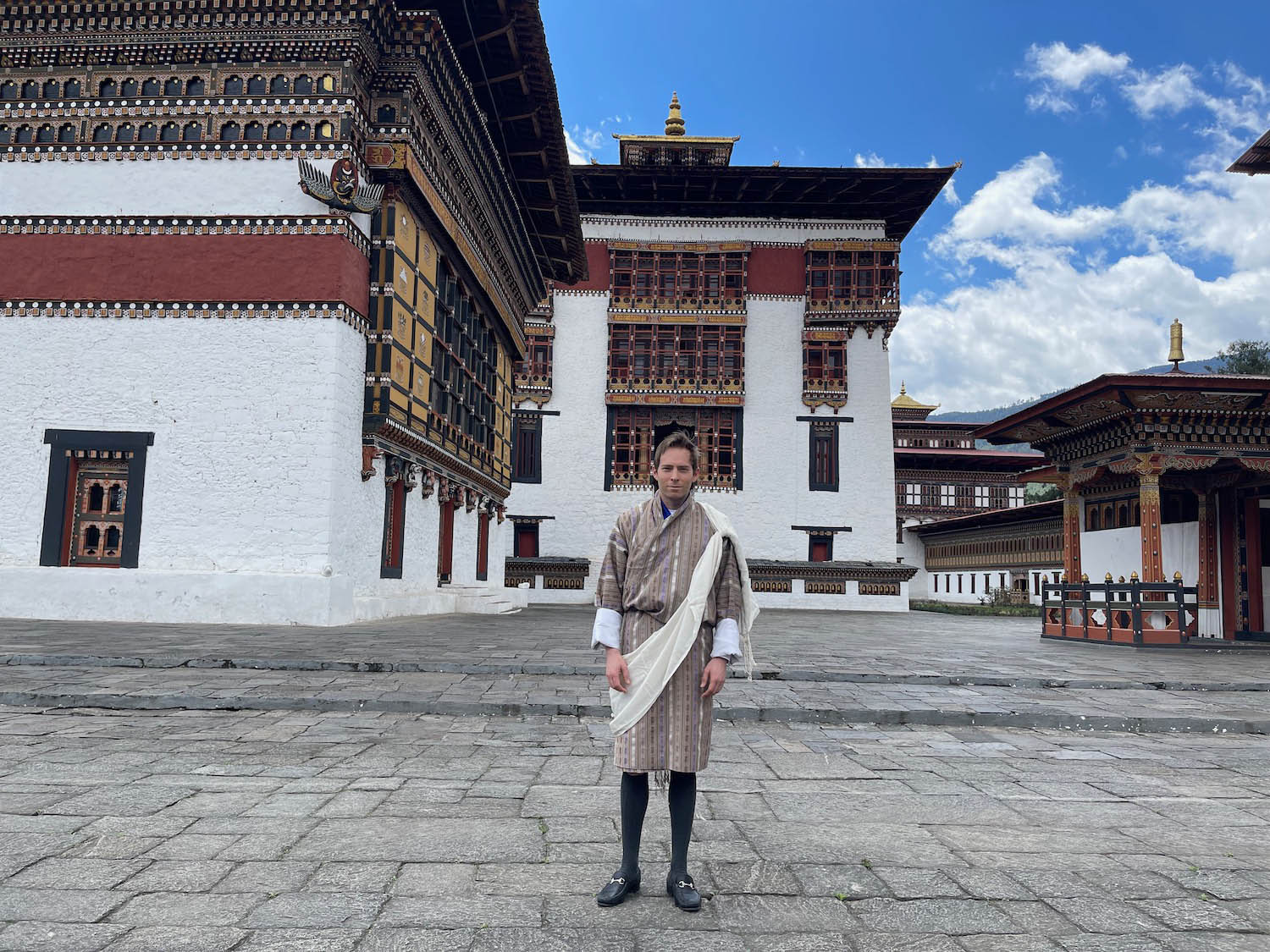 a man standing in front of a building