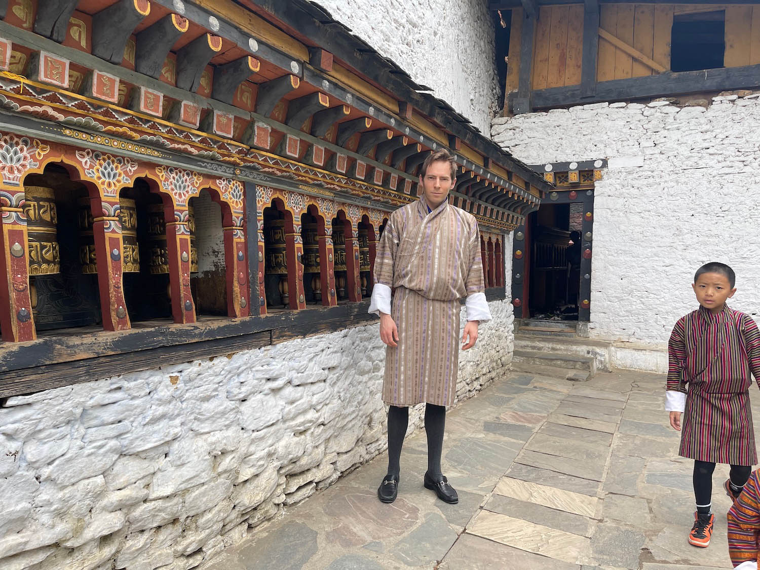 a man standing in front of a building