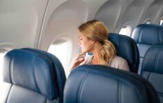 a woman sitting in an airplane