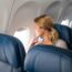 a woman sitting in an airplane