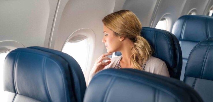 a woman sitting in an airplane